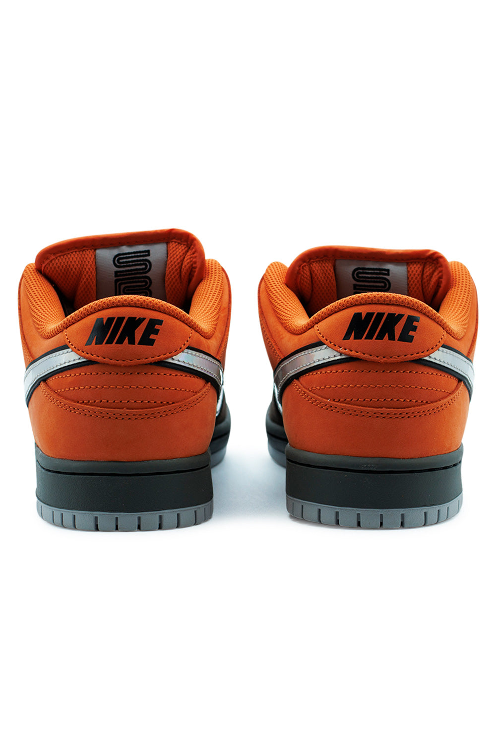 Rear view of Nike SB Dunk Low Pro Safety Orange Wolf Grey showcasing orange heel panels, Nike embroidered heel branding and reflective silver Swoosh detail on premium skateboarding sneaker
