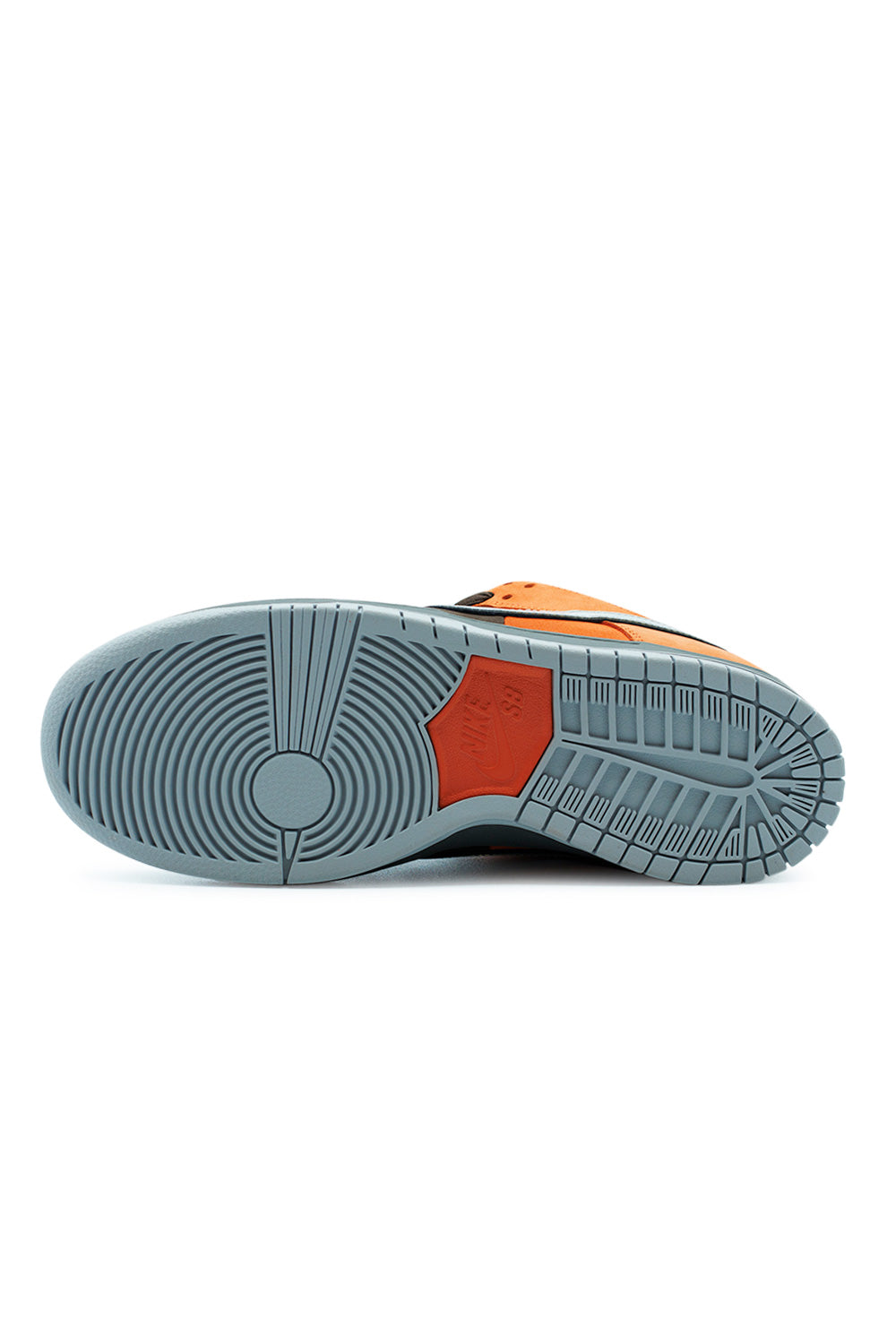 Nike SB Dunk Low Pro Safety Orange Wolf Grey outsole showing durable grey rubber traction pattern and Nike SB pivot circle design for optimal skateboard grip and board control