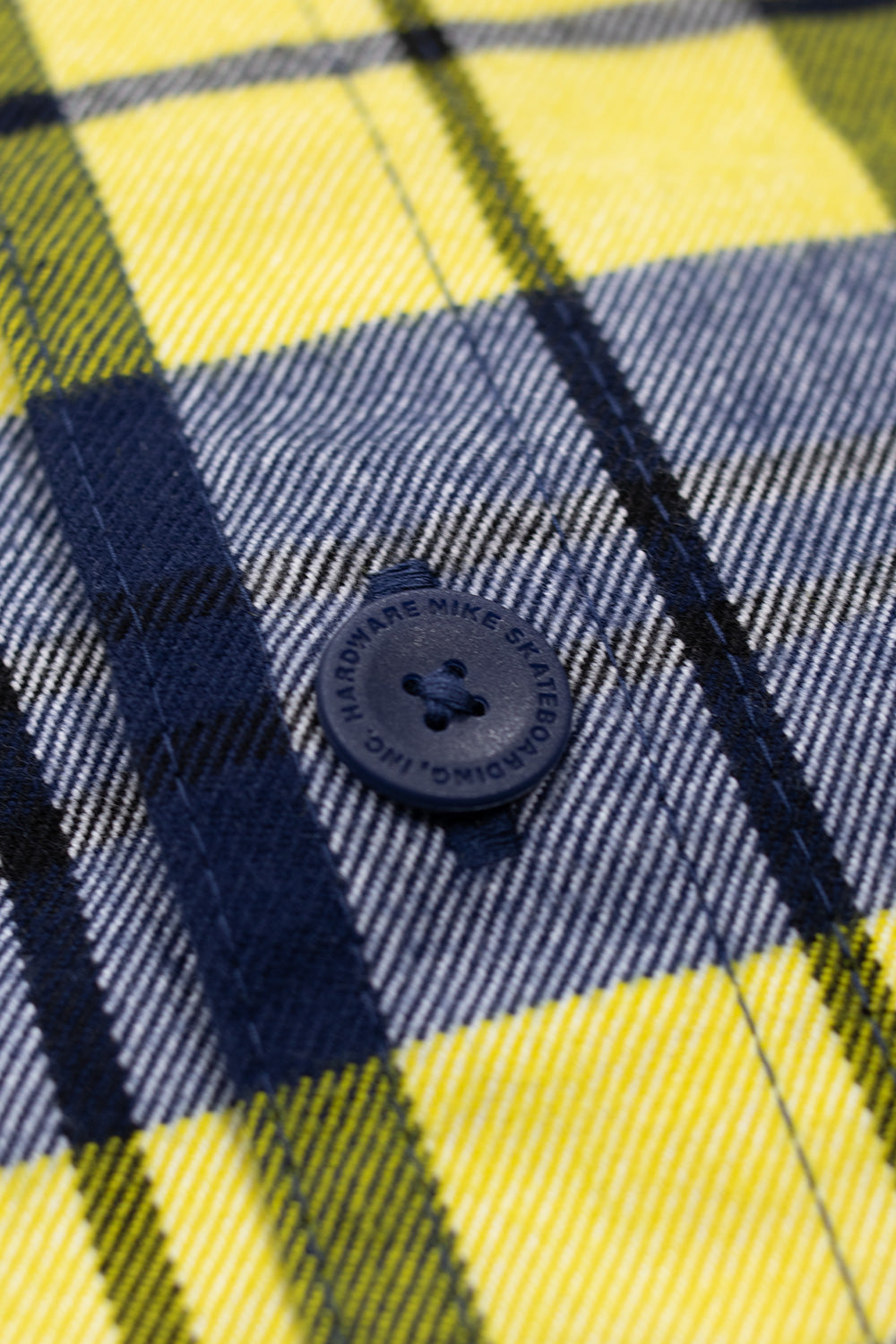 Unisex Nike SB Koston Flannel Longsleeve Midnight Navy Speed Yellow, functional skate shirt with chest pocket, embroidered Nike SB logo, and loose fit.