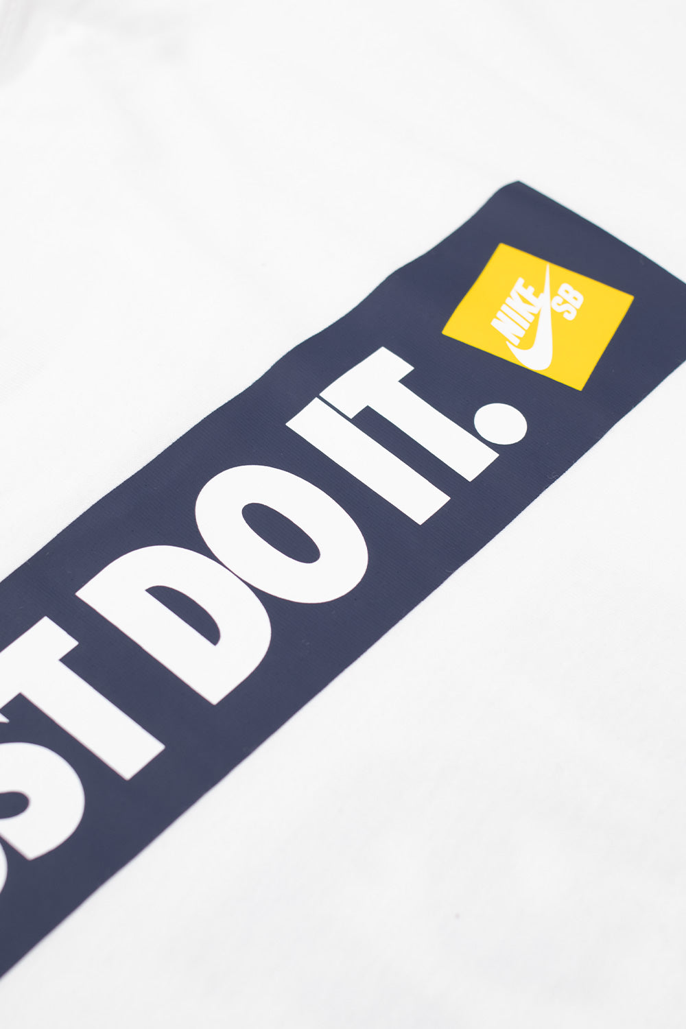 High-quality Nike SB M90 Koston White skate T-shirt, relaxed fit with front and back prints, embroidered chest logo, and casual streetwear aesthetic.