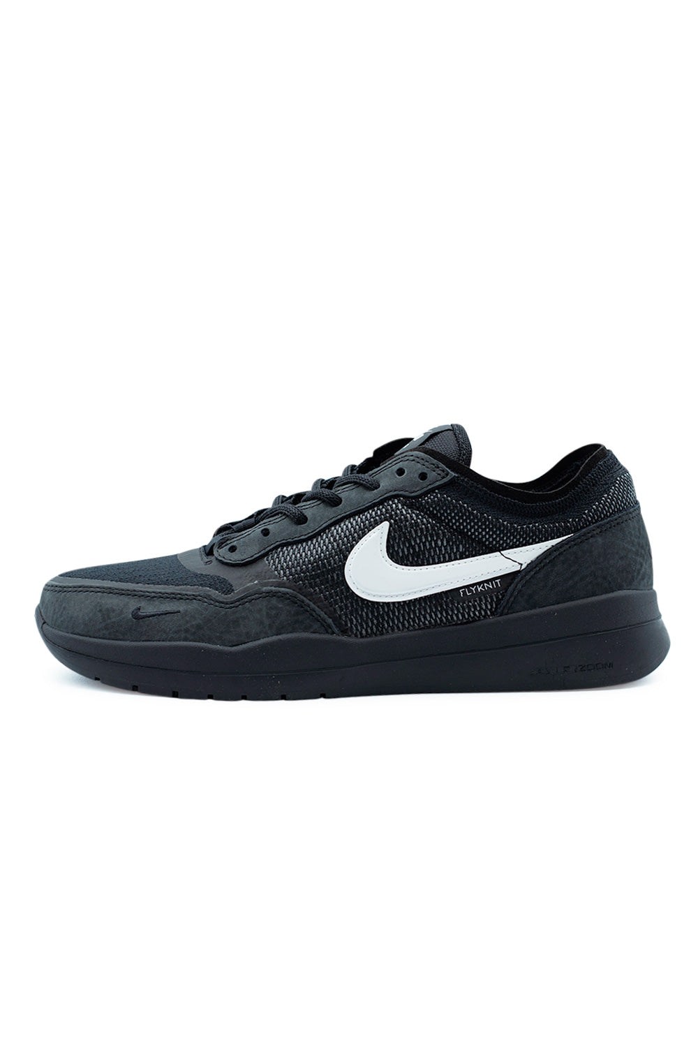 Nike SB PS8 skate shoe in black and white showing Flyknit upper with leather overlays, low-top performance skateboarding sneaker with Air Zoom cushioning and HART rubber outsole