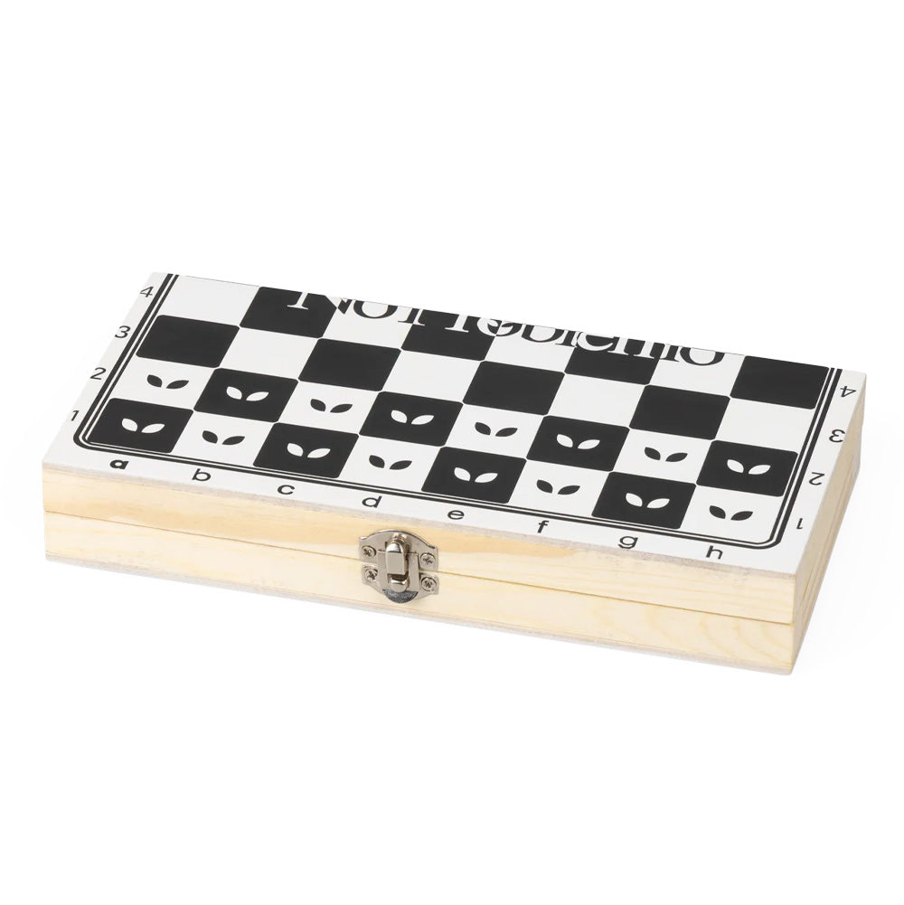 Perspective studio view of the closed Aries No Problemo folding wooden chess box, displaying the light natural pine wood casing, antique-finish silver metal latch closure, and the printed exterior playing grid with alien eye motifs and split center typography.