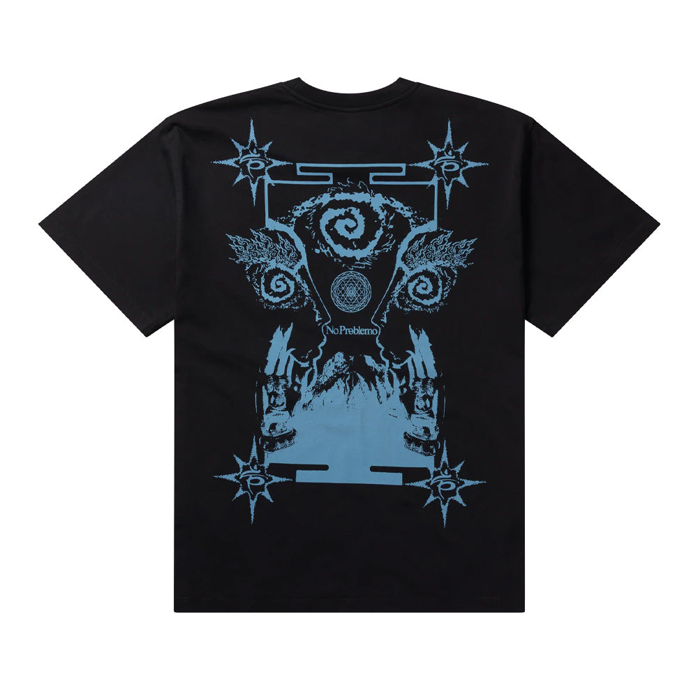 Back flat lay studio view of the Aries No Problemo Holy Mountain T-Shirt in solid black, showcasing a relaxed boxy cut in heavyweight cotton jersey, dominated by a large cerulean-blue occult graphic print with tarot-like frame borders, radiant stars, spiral eyes, mountain landscape, and centered "No Problemo" typography.