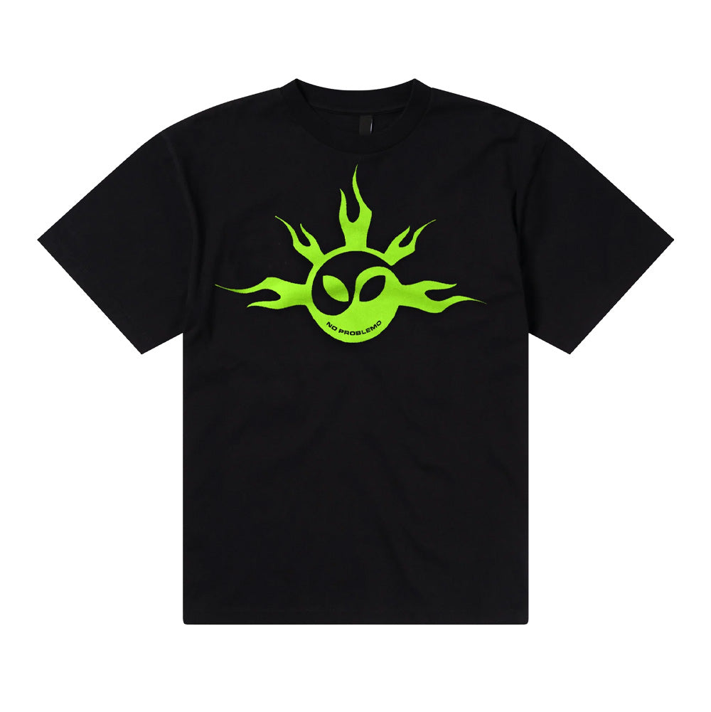 Front flat lay studio view of the Aries No Problemo No Yang T-Shirt in solid black, showcasing a relaxed boxy cut crafted from heavyweight cotton jersey, ribbed crew neckline, and a large chest graphic print featuring an electric neon green flaming sun motif integrated with a Yin-Yang alien head symbol and curved "NO PROBLEMO" typography.