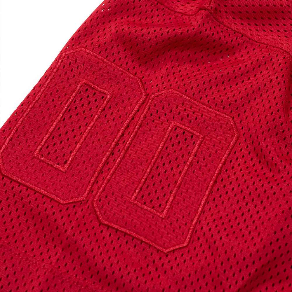 Macro studio close-up of the sleeve numbering on the red No Problemo Mesh Jersey, detailing the bold athletic numeral "00" applique crafted with tonal satin-stitch bordering on the ventilated mesh sleeve fabric.