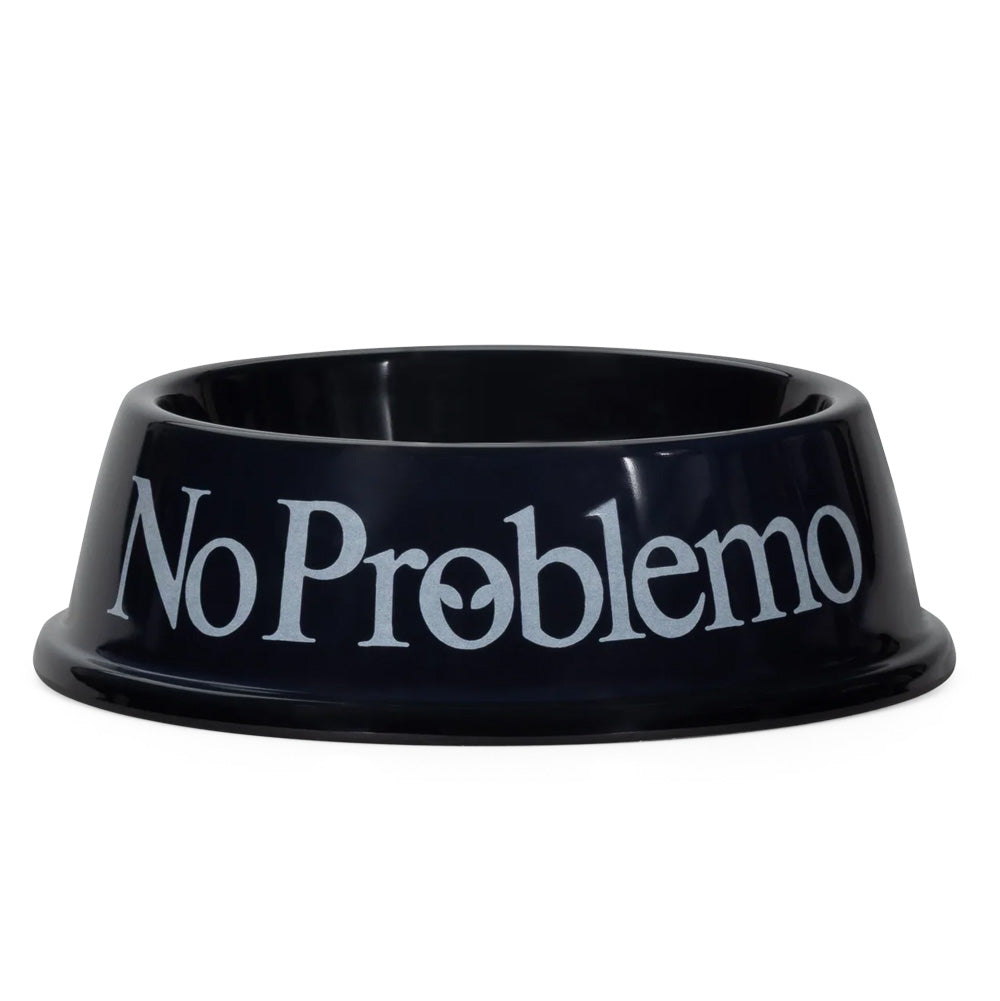 Side perspective studio shot of the Aries No Problemo Pet Bowl in glossy solid black, highlighting the durable, tapered melamine dog and cat feeding dish featuring a flared anti-tip base lip and crisp white serif "No Problemo" slogan branding printed boldly across the exterior front.
