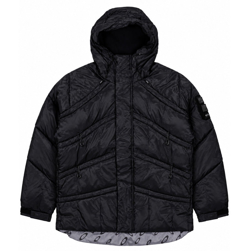 Front flat lay studio view of the Oakley FGL Stealth Ins Jacket 2.0 in Stealth Black, showcasing an insulated technical hooded puffer jacket tailored from water-repellent Schoeller fabric, featuring angled ergonomic quilted baffles, full-length storm flap closure, four front zip utility pockets with loop pullers, modular velcro patch system on the left upper arm, and an extended curved drop-tail hem lined with grey repeating Oakley Ellipse graphics.