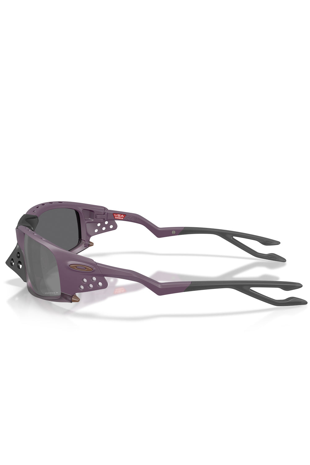Side profile studio shot of the Oakley Plantaris SQ Matte Aubergine sunglasses, displaying the multi-vented integrated side shields, bronze Oakley temple badge, and sculpted geometric earstems fitted with split Unobtainium traction earsocks.