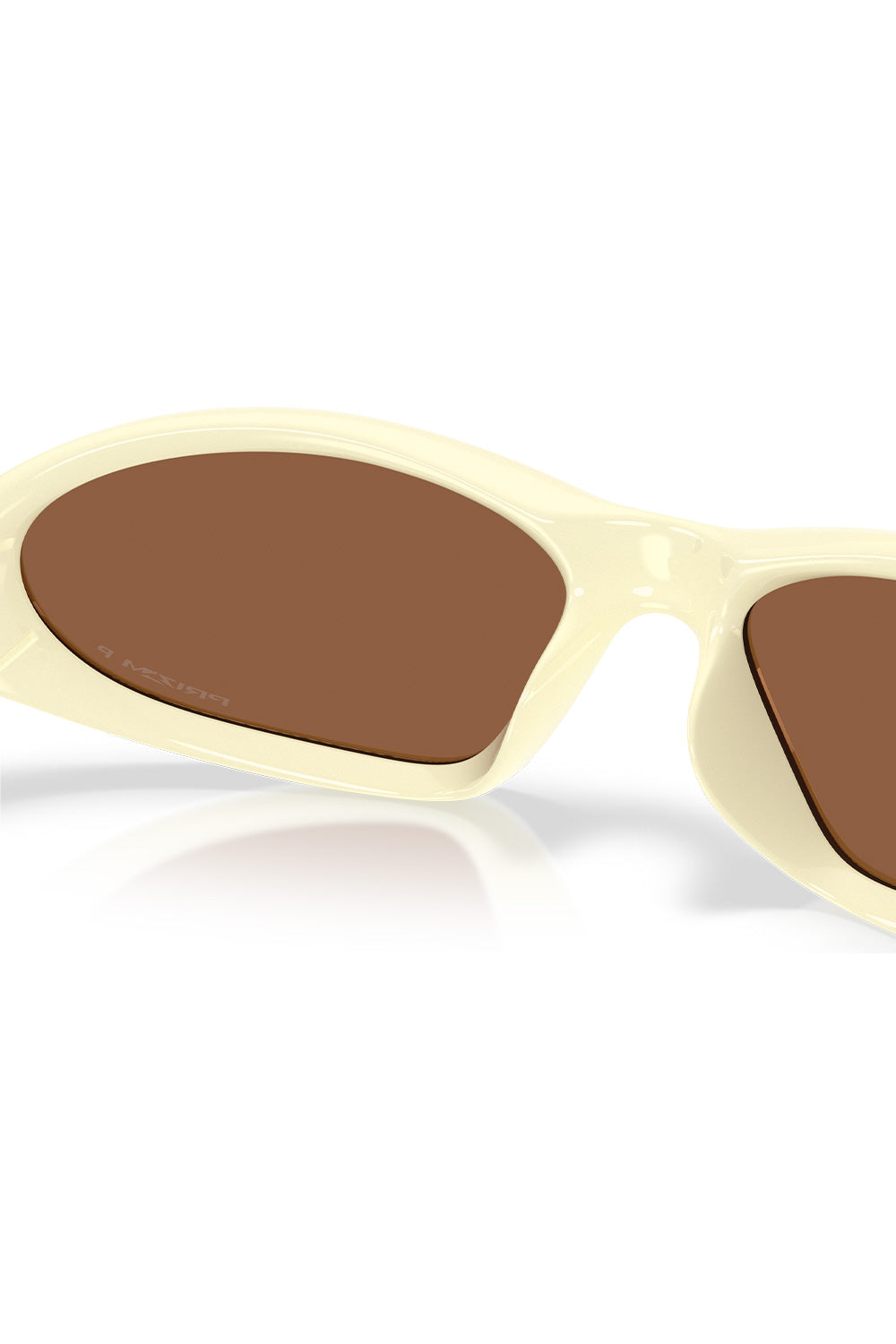 Detailed rear interior close-up of the Oakley Portal Jacket Cream frame, showcasing the smooth molded nose pads and warm amber view through the Prizm Tungsten Polarized optics.