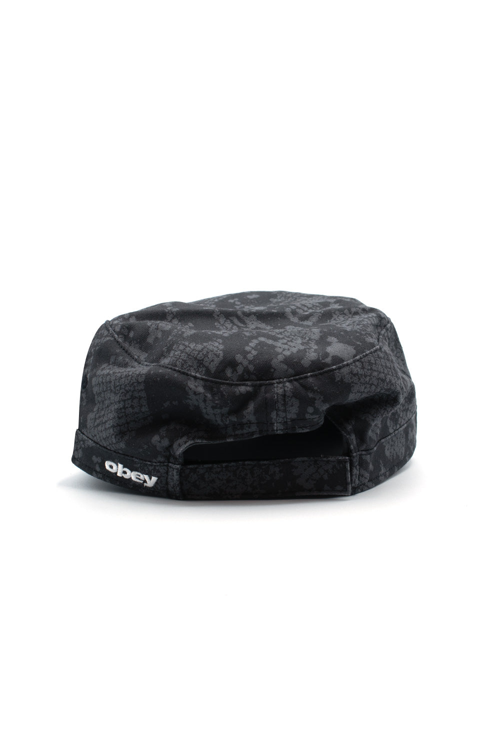 Rear perspective shot of the Obey Page Cadet Cap in Pigment Snake Skin, highlighting the semi-circular back opening, tonal adjustable Velcro strap closure, and crisp white embroidered Obey script lettering logo on the left side of the rear band.