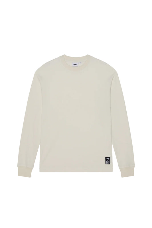 Front flat lay view of the Obey Post Thermal Longsleeve shirt in Dusty Chalk, designed in a relaxed streetwear fit from heavy coarse waffle-knit cotton-poly fabric in an off-white cream shade, featuring a ribbed crewneck, matching ribbed wrist cuffs, straight hem, and a sewn-on square Obey André the Giant patch at the lower left hemline.