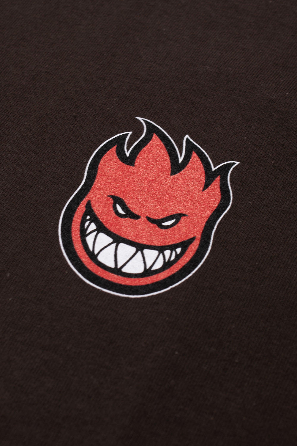 "Dunkelbraunes Spitfire Wheels T-Shirt mit kleinem Bighead-Logo auf der Brust"​
