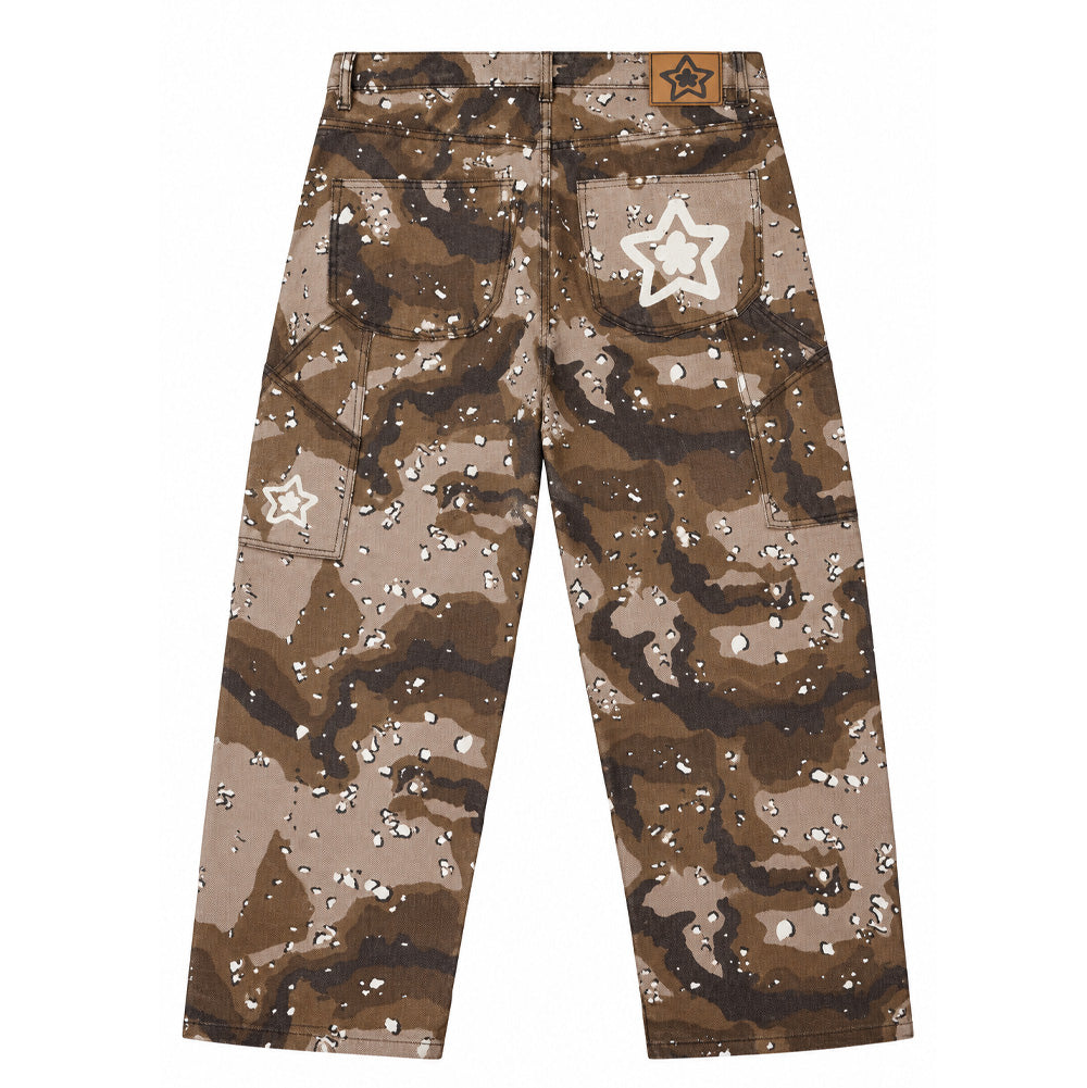 Back flat lay studio view of the Starteam East Village Chocolate Chip Camo Star Jeans in earthy brown, showcasing a wide-leg baggy skate silhouette cut from heavyweight cotton twill featuring an allover six-color desert chocolate chip camouflage pattern, utility carpenter pockets on both side thighs, a tan faux-leather jacron waistband patch, and signature white chain-stitched Starteam flower-star logo embroideries across the right back pocket and right leg utility tool pocket.