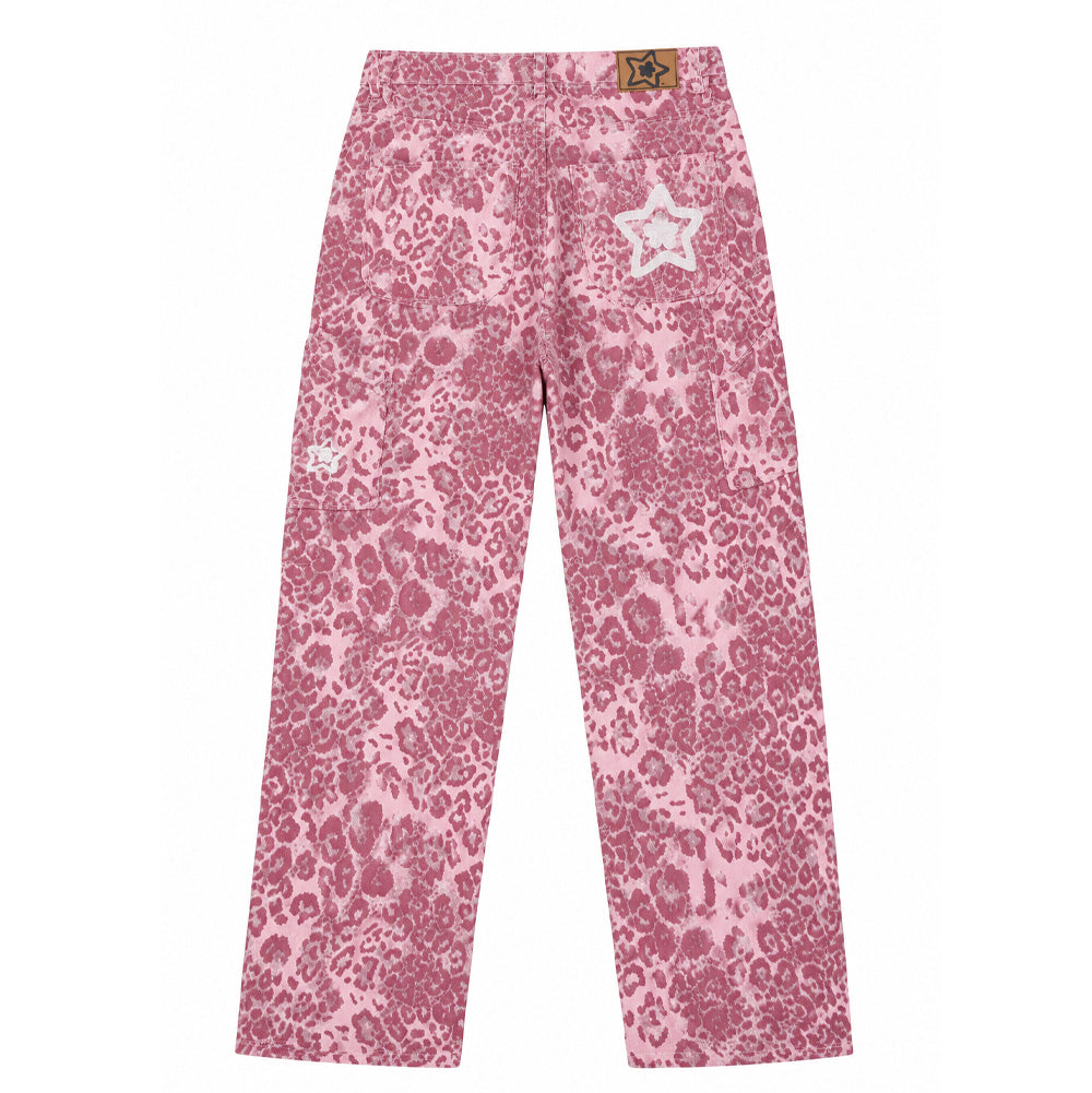 Back flat lay studio view of the Starteam East Village Leopard Star Jeans in vibrant pink and white, showcasing an oversized, wide straight-leg baggy skate denim silhouette printed in an allover distressed leopard rosette pattern, equipped with angled side carpenter pockets, a caramel-brown faux-leather jacron patch along the rear waistband, and raised white chain-stitched Starteam flower-star logo embroideries across the back right pocket and side leg panel.