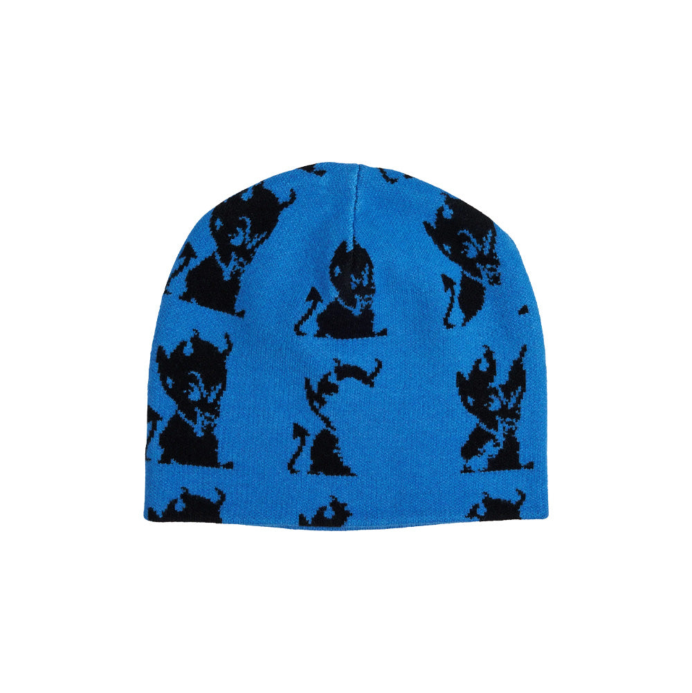 Front flat lay view of the Token Layback Beanie in vibrant cyan blue, showcasing an unrolled cuffless rounded skull cap silhouette crafted from fine-gauge knit fabric, featuring a repeating all-over black jacquard-knit pattern of the signature seated baby devil cartoon mascot complete with horns and pointed tail