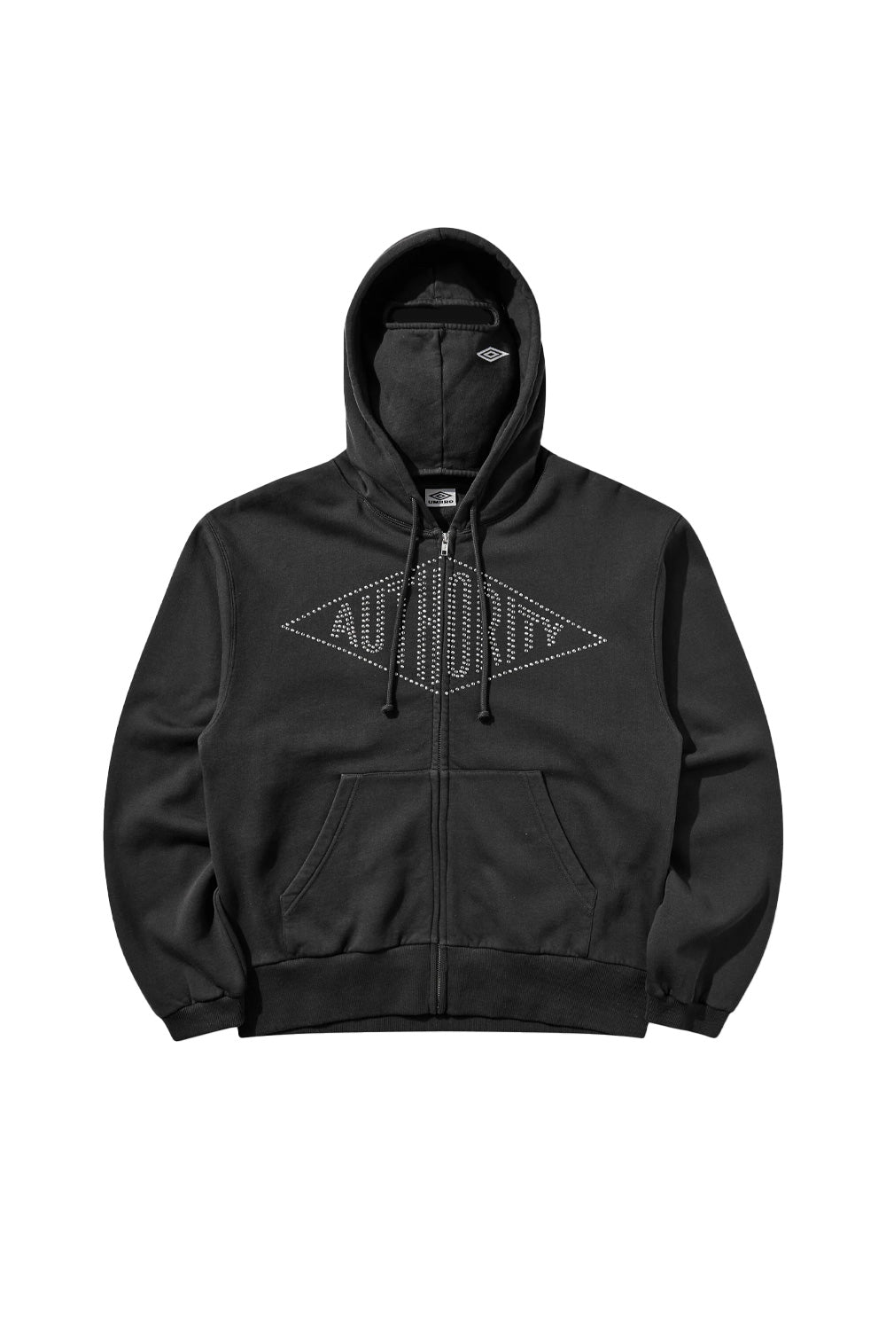 Front flat lay view of the Umbro Authority Zipped Hoodie in washed black, featuring a relaxed boxy fit, full-length front metal zipper, split kangaroo pouch pocket, wide ribbed hem and cuffs, an integrated balaclava face mask panel in the hood, and a prominent diamond-shaped chest design crafted from silver metal studs spelling out "AUTHORITY"