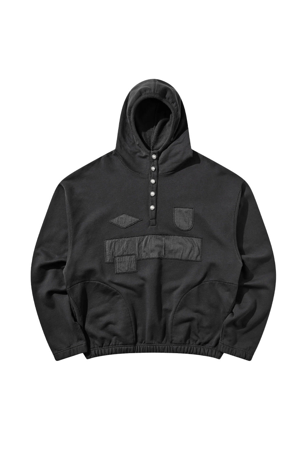 Front flat lay view of the Umbro Censored Pearls Hoodie in washed black, featuring a wide boxy cut, elasticated waistband and cuffs, a high neck hood with a five-button front placket adorned with pearl buttons, side pockets, and raw-edged tonal black jersey patches covering the chest logo and sponsor area with exposed zig-zag topstitching