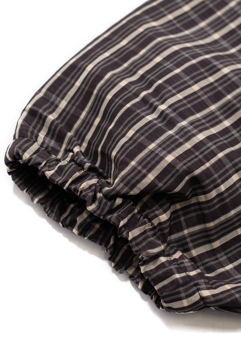 Elasticated cuff and textured check fabric detail on Umbro Check Smock Anorak Beige Dark Brown pullover jacket