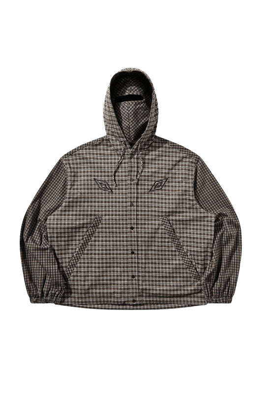 Front flat lay view of the Umbro Double Plaid Jacket in dark brown, showcasing a boxy button-front hooded overshirt constructed with contrasting plaid patterns on the body and sleeves, elasticated cuffs and hem, dual chest embroidery of the Umbro double diamond logo, slanted welt pockets, and a hood with an integrated matching plaid balaclava face mask featuring a narrow eye slit
