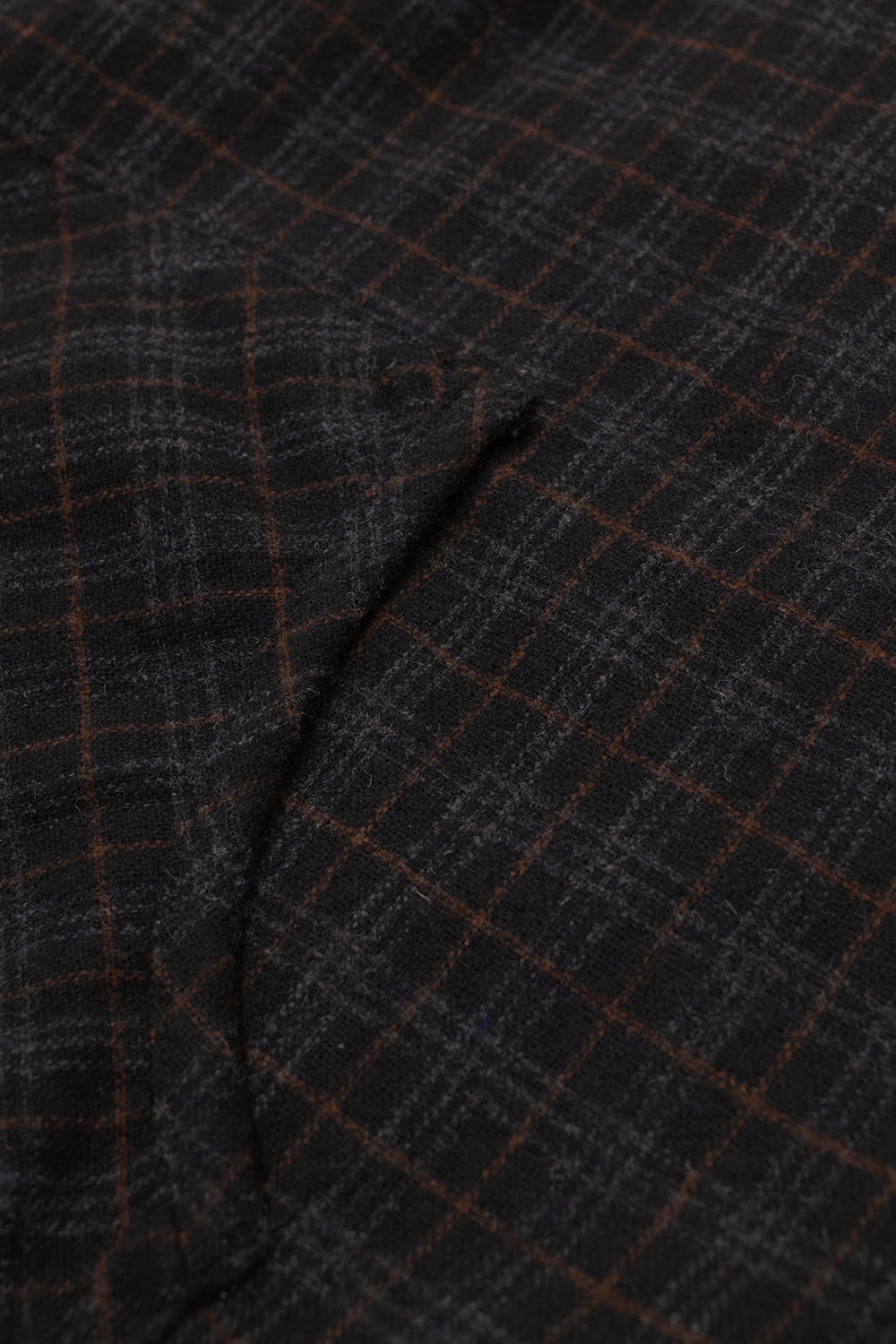 Studio close-up view of the front kangaroo pouch pocket on the Umbro Flannel Fur Anorak, detailing the diagonal pattern alignment, seamless corner stitch reinforcement, and soft brushed flannel fabric