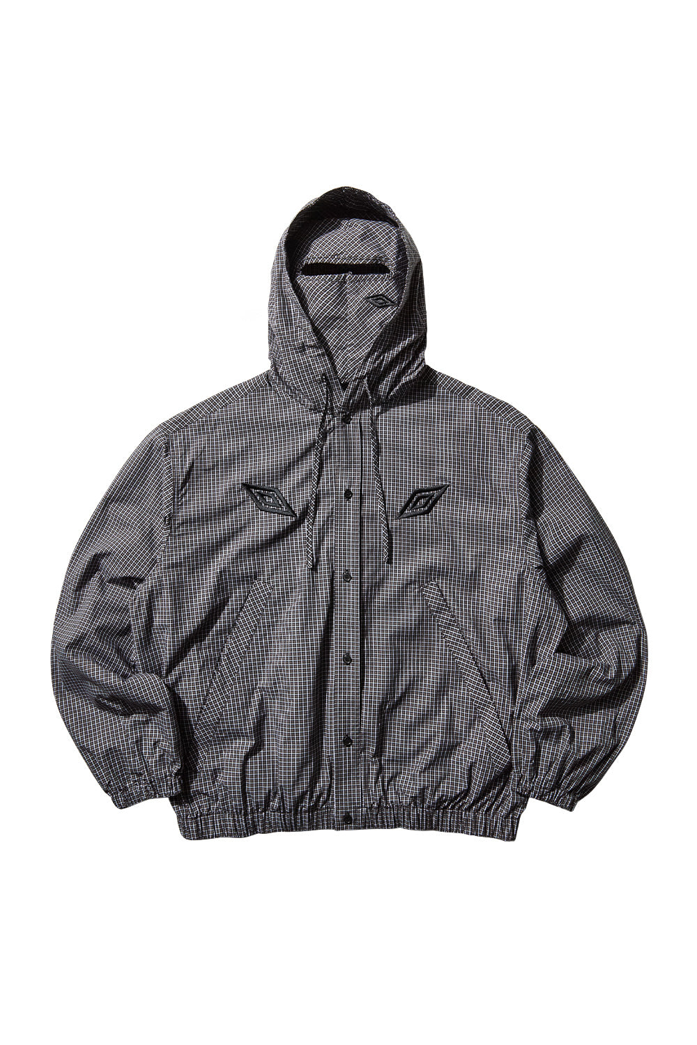 Front view of the Umbro Gingham Masked Shirt Coffee Brown / White, showcasing the button-up closure, embroidered Umbro double diamond logo and relaxed oversized fit for contemporary urban layering.