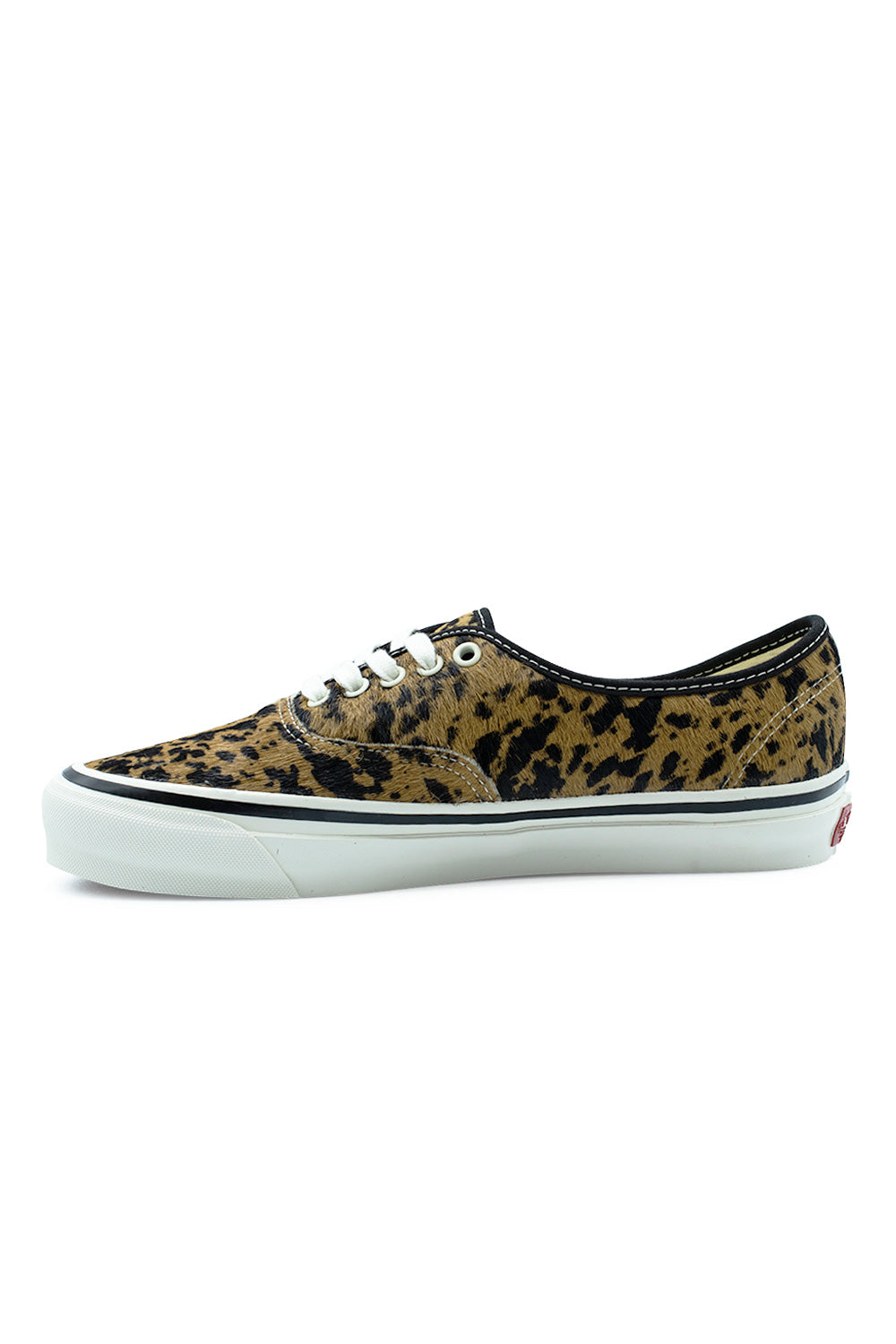 Medial side profile view of the Vans LX Authentic 44 shoe in Cow Marshmallow, illustrating the seamless inner cowhide pony hair panel, clean black rim binding, and thick vulcanized rubber sole with signature toe bumper.