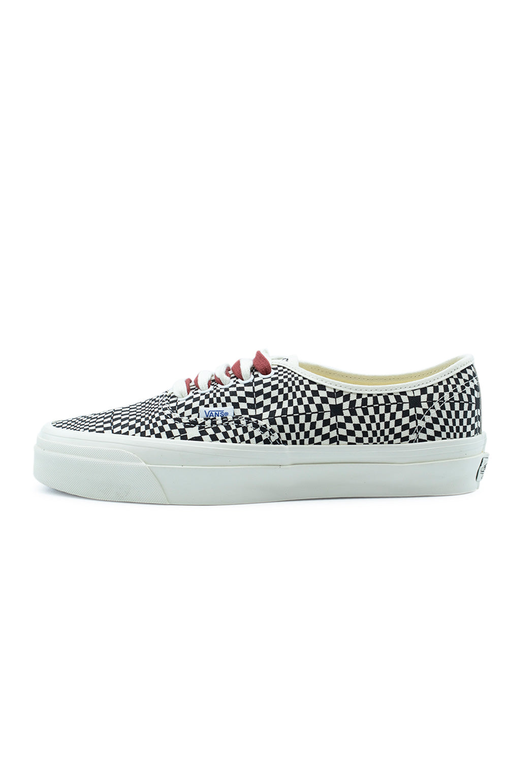 Lateral side profile view of the Vans LX Authentic 44 Heritage Black sneaker, showcasing the optical illusion distorted checkerboard canvas upper, red and white dual-layered laces, blue Vans flag tag, and a thick off-white vulcanized sole.