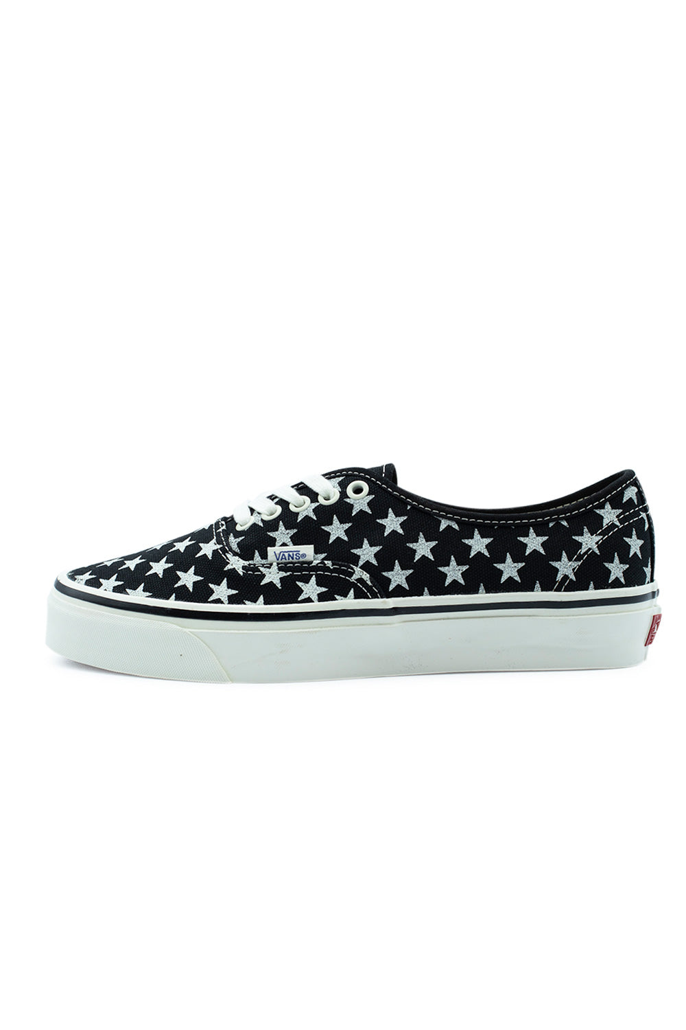 Lateral profile view of the Vans LX Authentic 44 sneaker in (Stars) Black / Marshmallow, featuring a heavy-duty black canvas upper covered in printed white stars, white metal eyelets, white cotton laces, and a thick marshmallow-colored vulcanized sole with a black foxing stripe.