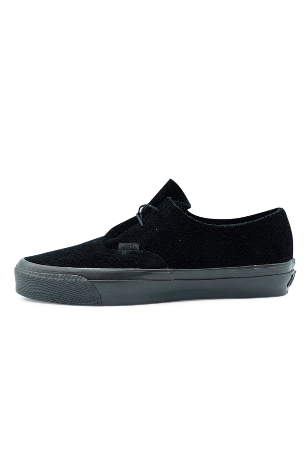 Lateral side profile view of the Vans LX Authentic Ease sneaker in Black / Faded Black, highlighting the textured deep black hairy suede upper, minimal two-eyelet thin cord lacing system, black Vans flag tag, and faded black vulcanized sole.