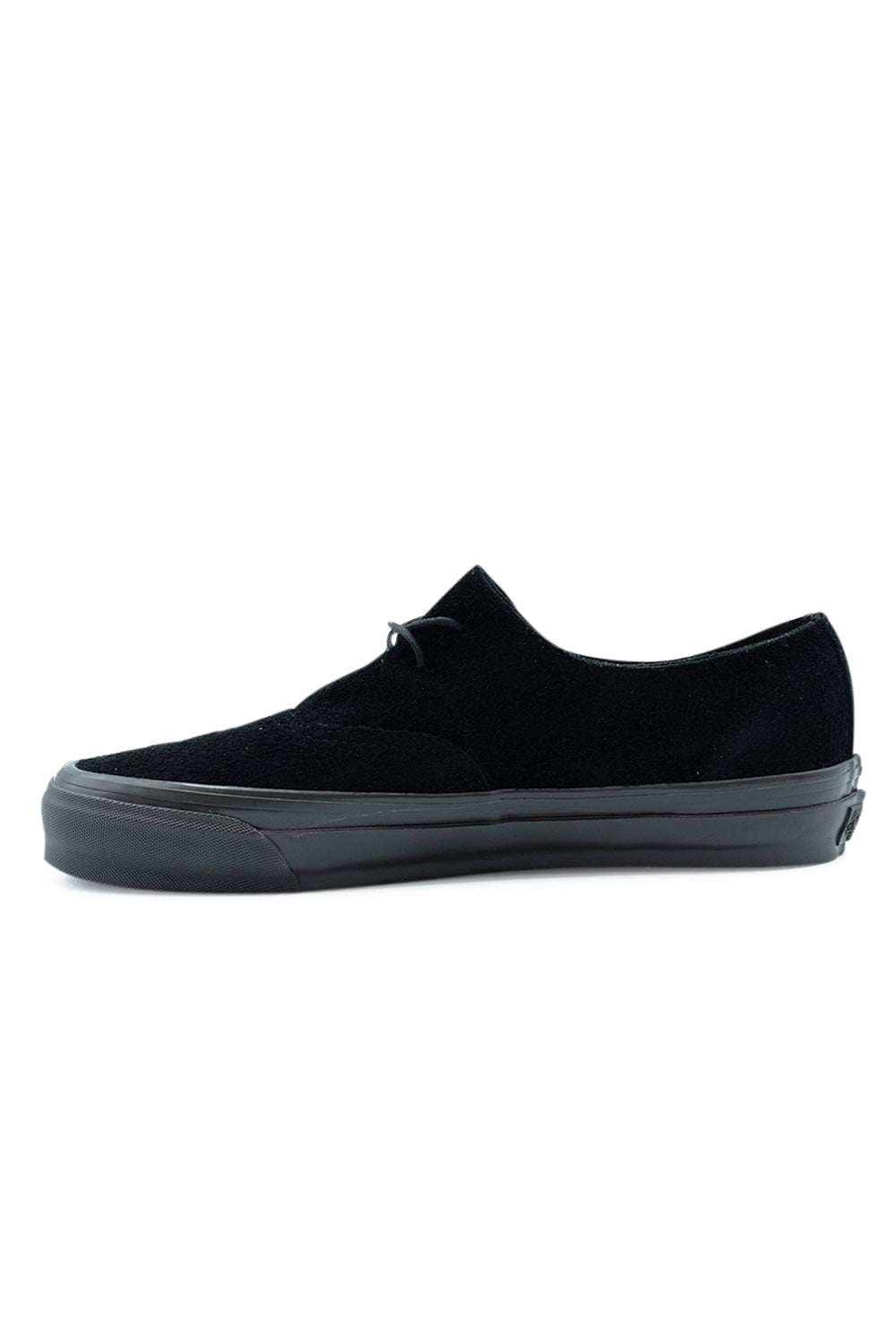 Medial side profile view of the Vans LX Authentic Ease shoe in Black / Faded Black, demonstrating the seamless inner hairy suede panel, minimal eyelet construction, high sidewall rubber tape, and streamlined aesthetic.