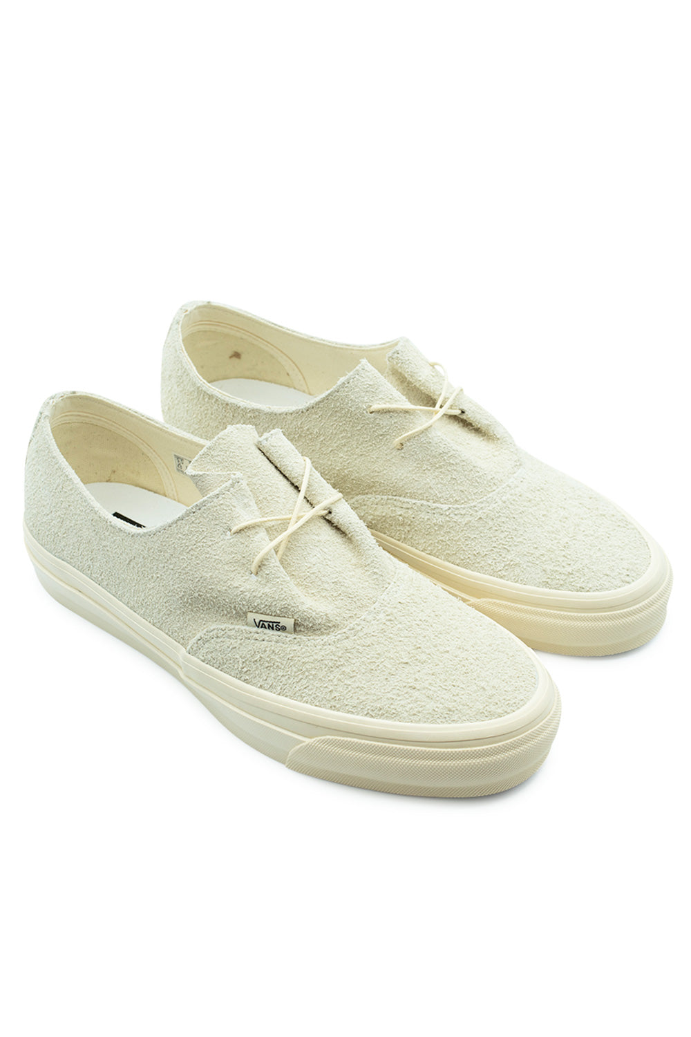 Three-quarter perspective studio shot of the Vans LX Authentic Ease Hairy Suede Sand sneakers, showcasing the deconstructed low-profile shape, tactile rough suede surface, and matching cream rubber midsole.