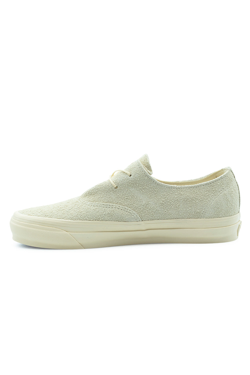 Medial side profile view of the Vans LX Authentic Ease shoe in Hairy Suede Sand, demonstrating the uninterrupted inner sand suede panel, minimal eyelet construction, and high sidewall rubber foxing tape.
