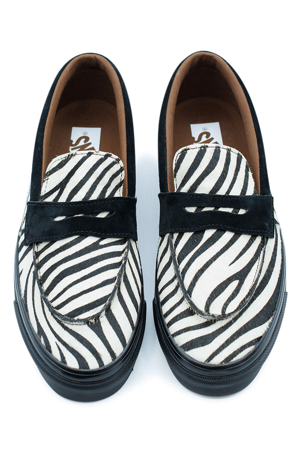 top view Vans Loafer 53 zebra pony hair showcasing black and white animal print pattern, slip-on penny loafer design with premium leather construction and cushioned insole
