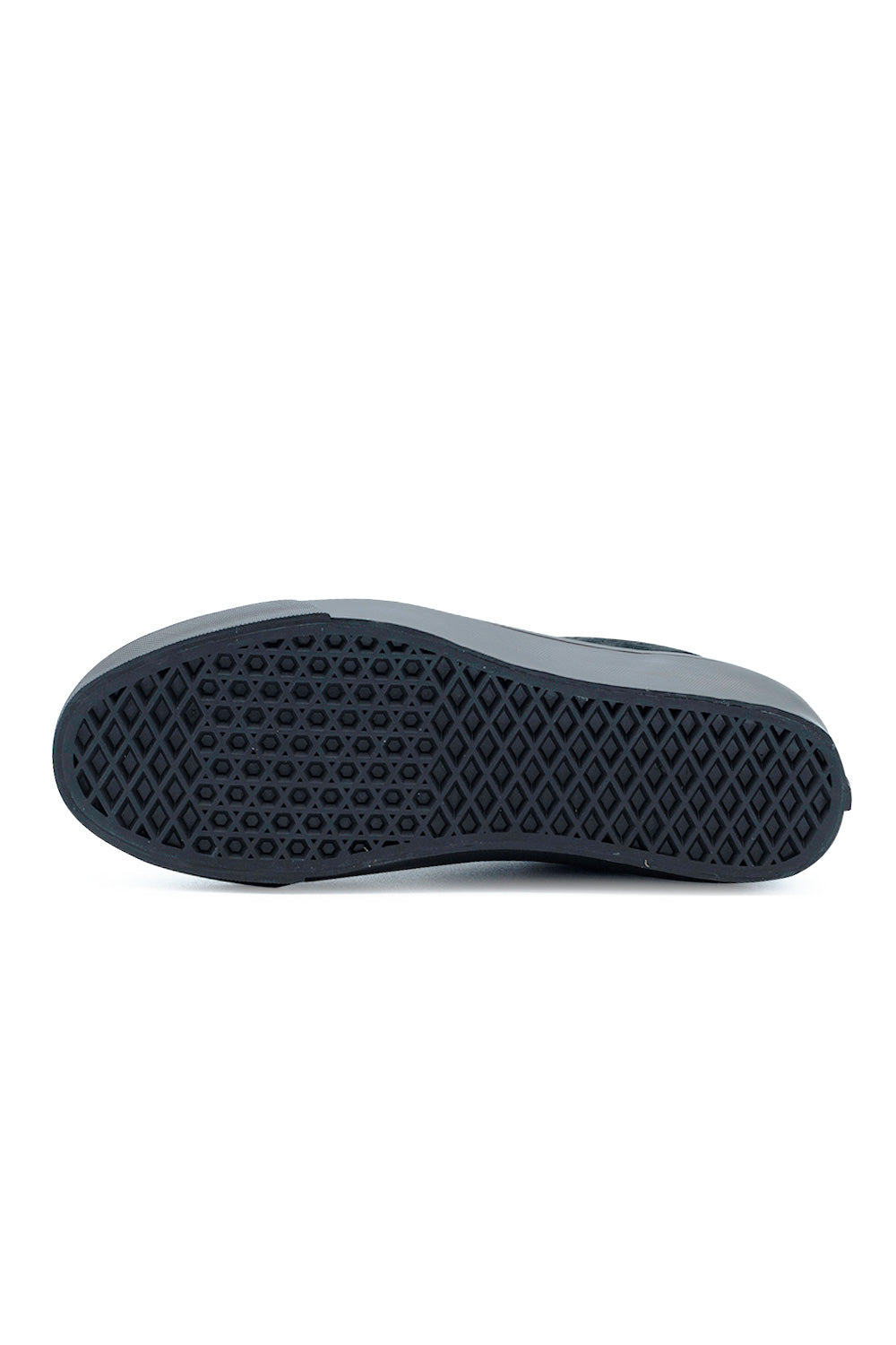 Full bottom view of the black vulcanized rubber outsole on the Vans LX SF Moc Low shoe, displaying the iconic diamond waffle tread pattern engineered for flexible board feel and dependable street grip.