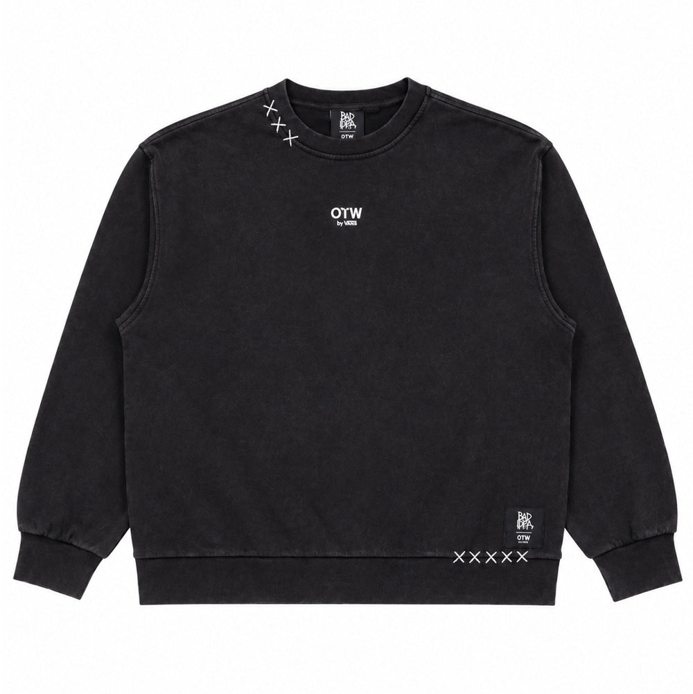 Front flat lay studio perspective of the black Vans OTW x Chito Sweatshirt, highlighting the thick ribbed collar, dropped shoulder seams, miniature white screen-printed "OTW by VANS" chest logo, white embroidered 'XXX' cross-stitches along the right shoulder, and a black woven Bad Idea OTW collaboration tag accented by white 'XXXXX' cross-stitches along the bottom hem.