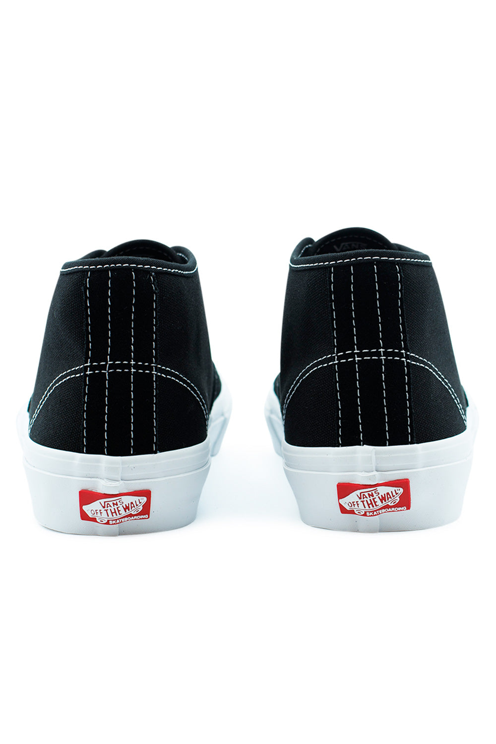 Rear angle of Vans Skate Authentic Mid Black White showing padded mid-cut collar, heel stitching detail, and vulcanized rubber outsole for boardfeel and stability.