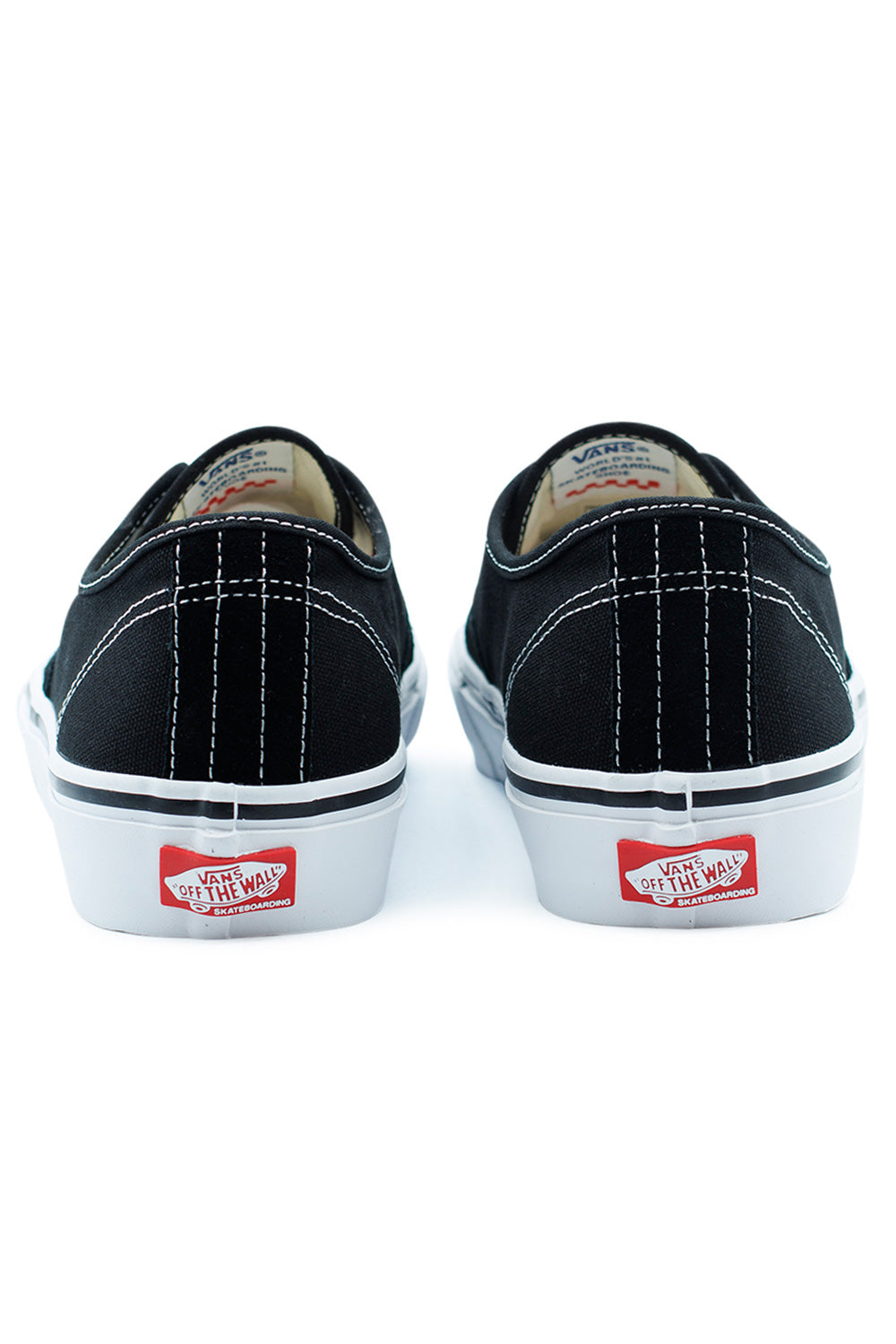 Rear angle of Vans Skate Authentic skate shoes in black and white showing heel stitching, Off The Wall logo tab and padded collar detail