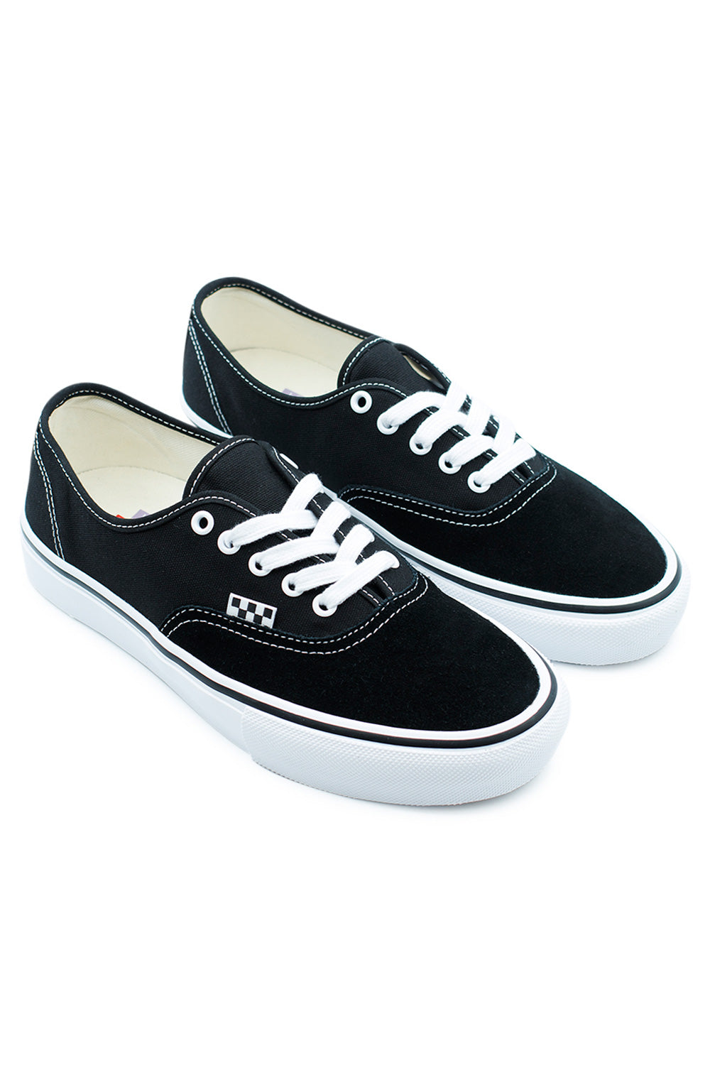 Pair of Vans Skate Authentic Black White sneakers angled view highlighting classic skate shoe design, vulcanized outsole and contrast stitching