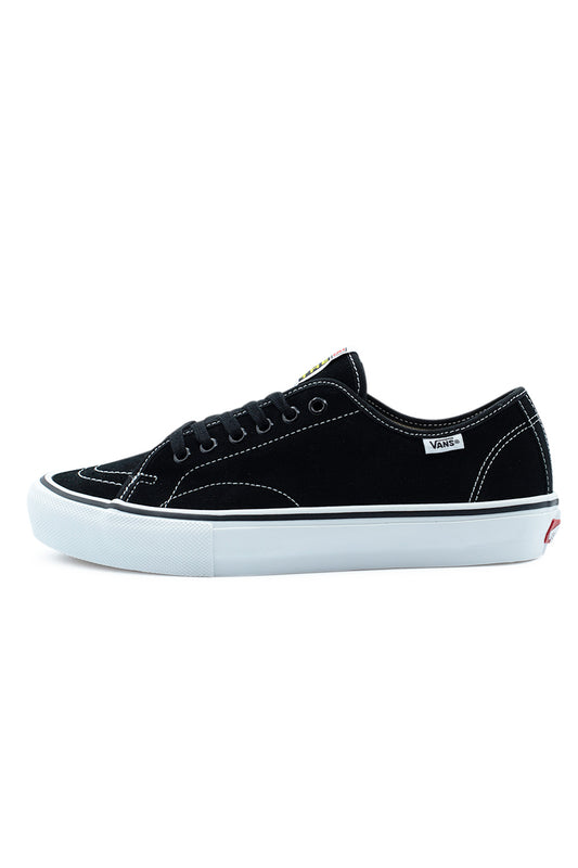 Lateral side profile view of the Vans Skate AVE Classic sneaker in Black / White, featuring a premium black full-suede upper, white contrast stitching along reinforced panels, black metal eyelets, a white woven Vans tag, and a crisp white vulcanized midsole.