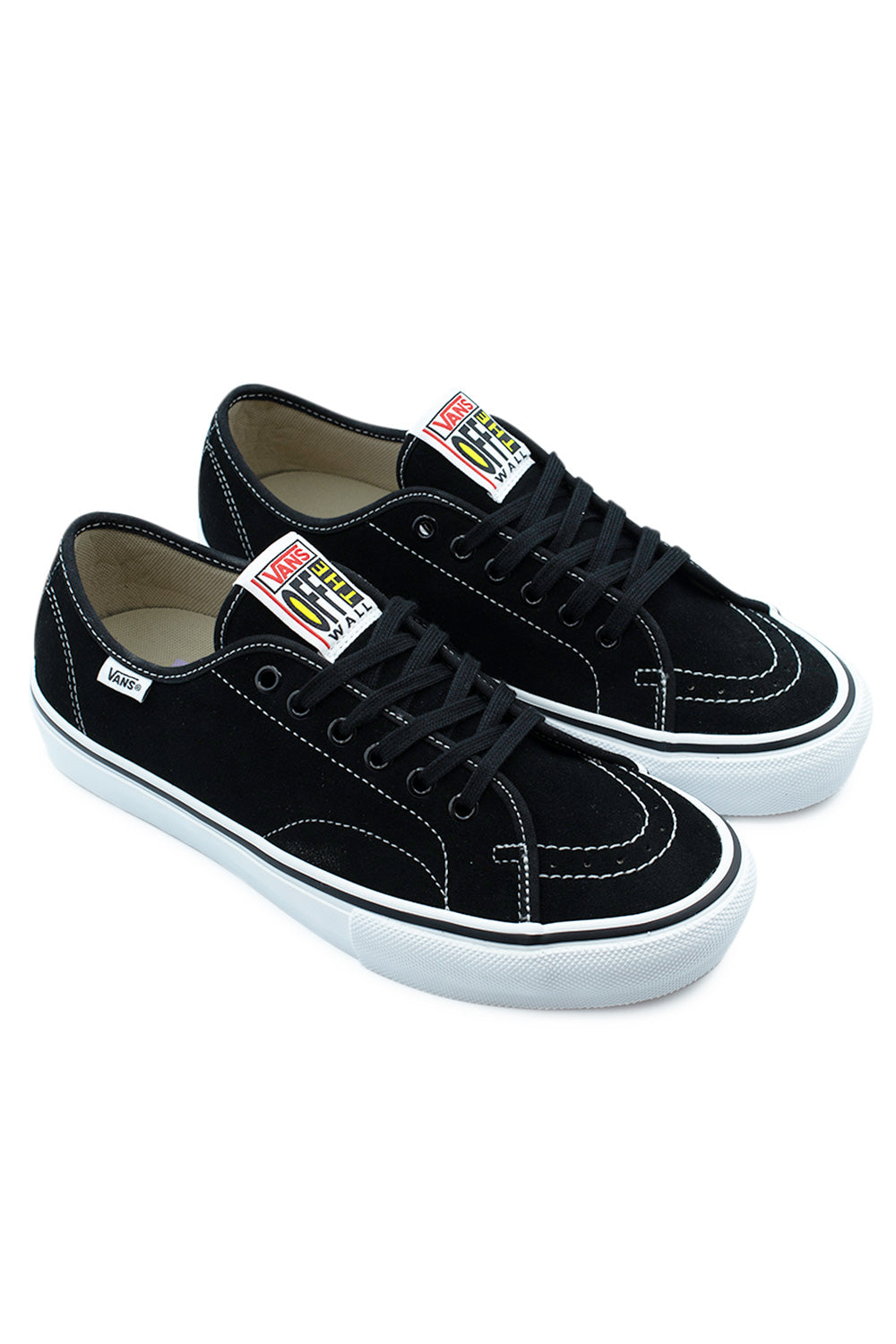 Three-quarter perspective studio shot of both Vans Skate AVE Classic sneakers, highlighting Anthony Van Engelen's signature low-top design, reinforced toe bumper, white foxing tape, and clean black suede construction.