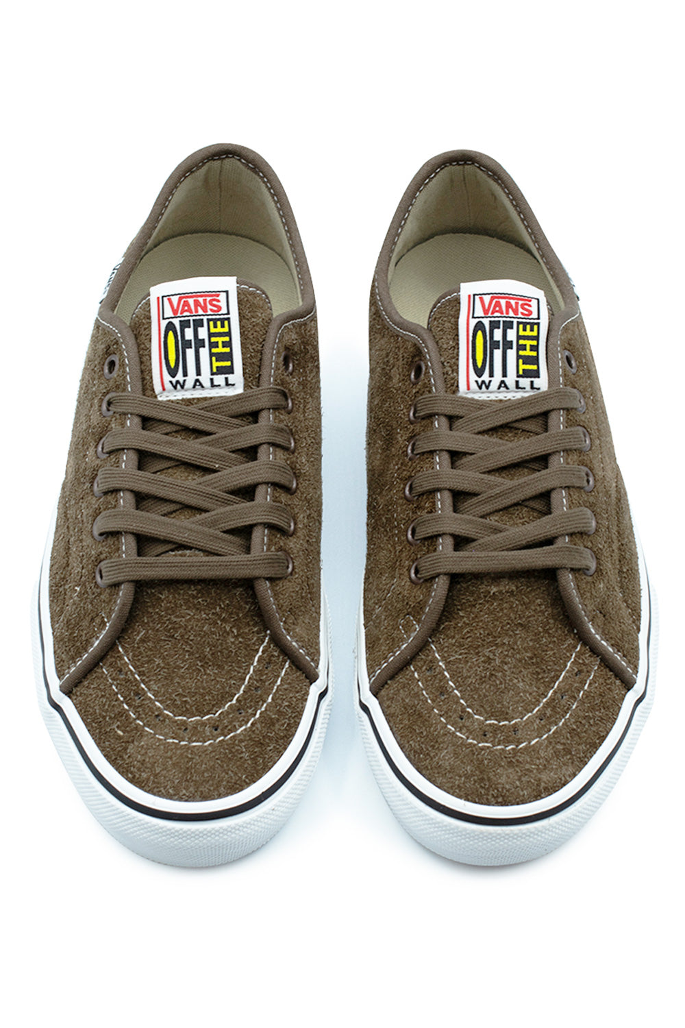 Top-down view of a pair of Vans Skate AVE Classic shoes in Vintage Cocoa brown, highlighting the reinforced hairy suede toe box with contrast white stitching, tonal flat laces, and vertical retro Vans Off The Wall woven tongue labels with red and yellow font accents.