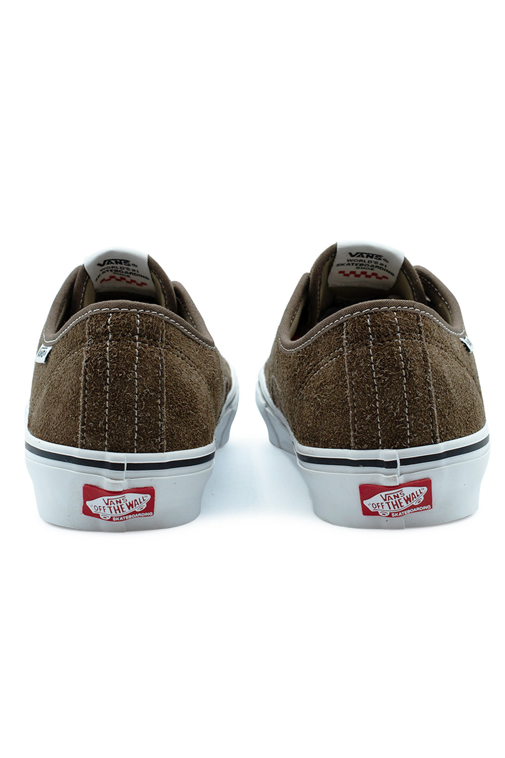 Rear view of the heels of the Vans Skate AVE Classic sneakers, showing the rough-textured Vintage Cocoa brown suede heel counters, vertical white accent stitching, padded ankle collars, and red rubber Vans Skateboarding Off The Wall license plates on the white foxing tape.