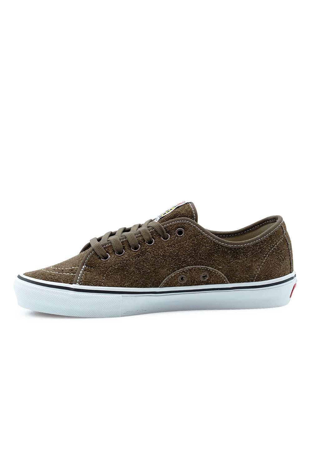 Medial arch view of the Vans Skate AVE Classic shoe in Vintage Cocoa, showing the clean inner suede quarter panel, reinforced ventilation eyelets, subtle embossed Duracap logo along the front rubber foxing wrap, and white vulcanized midsole.