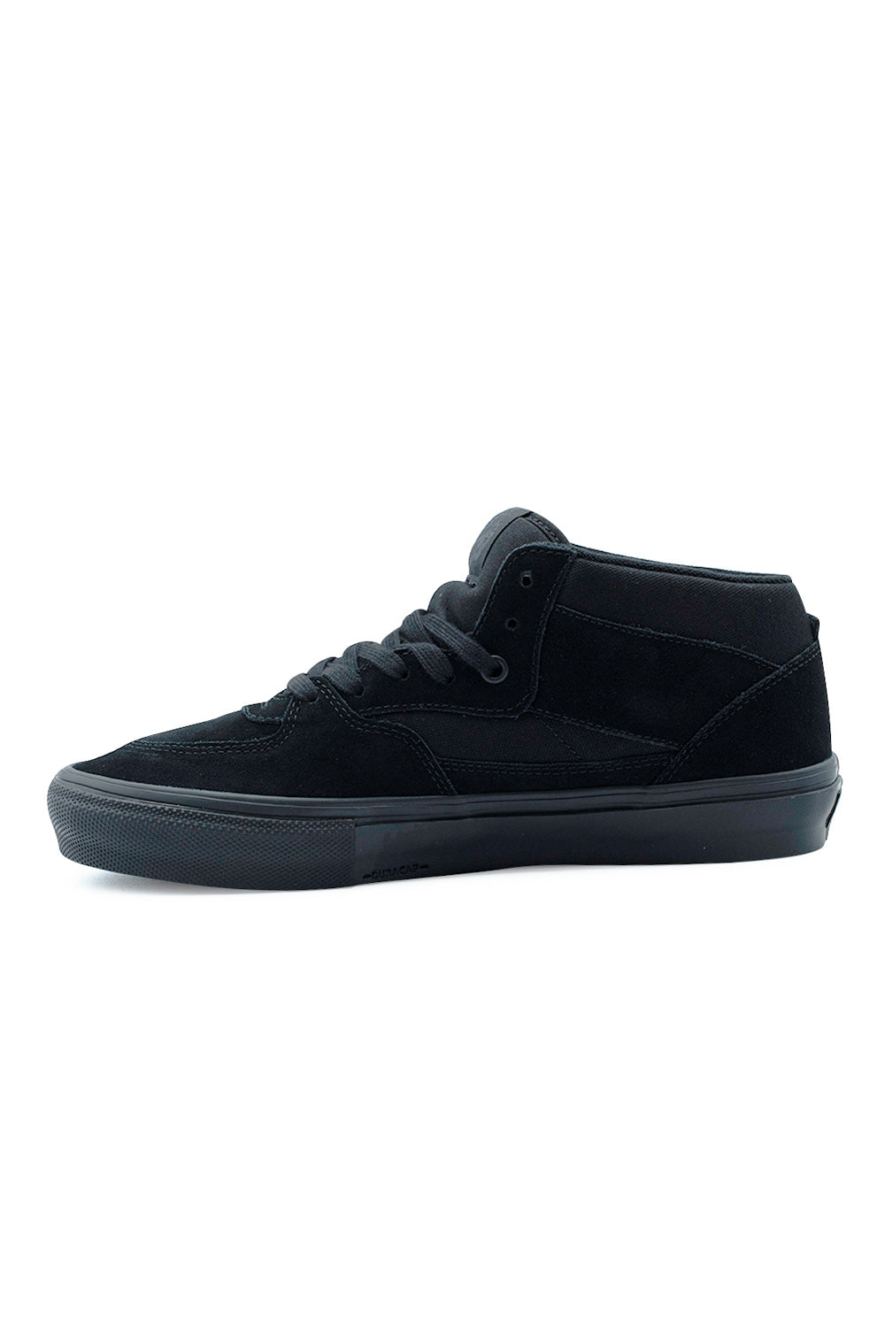 Medial side profile view of the Vans Skate Half Cab shoe in solid black, detailing the multi-panel construction of canvas and rough-out suede, embossed Duracap logo text along the reinforced toe bumper wrap, and clean black metal eyelets.