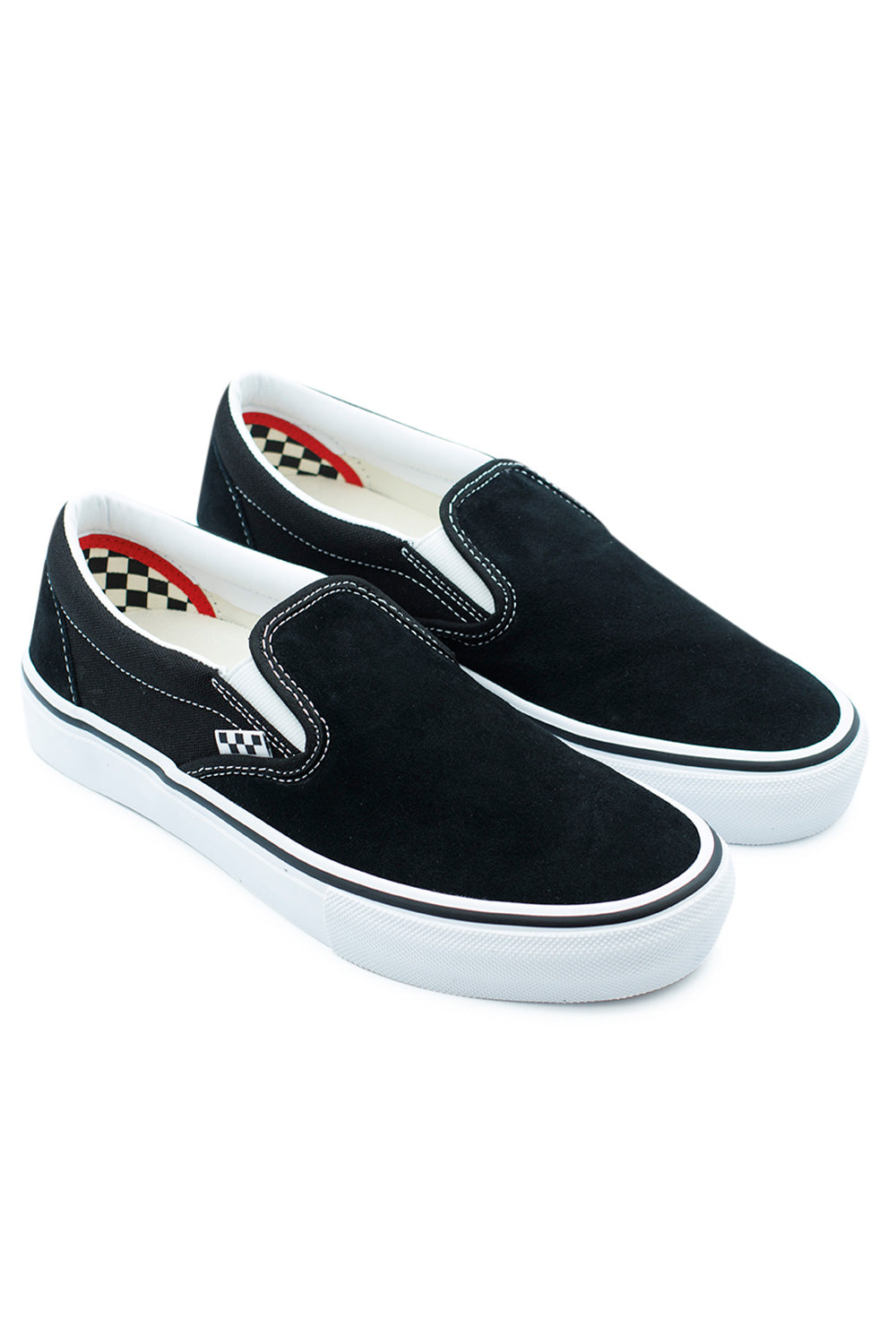 Angled pair of Vans Skate Slip-On Black and White skateboarding shoes featuring low-profile silhouette, canvas panels, and high-traction waffle sole