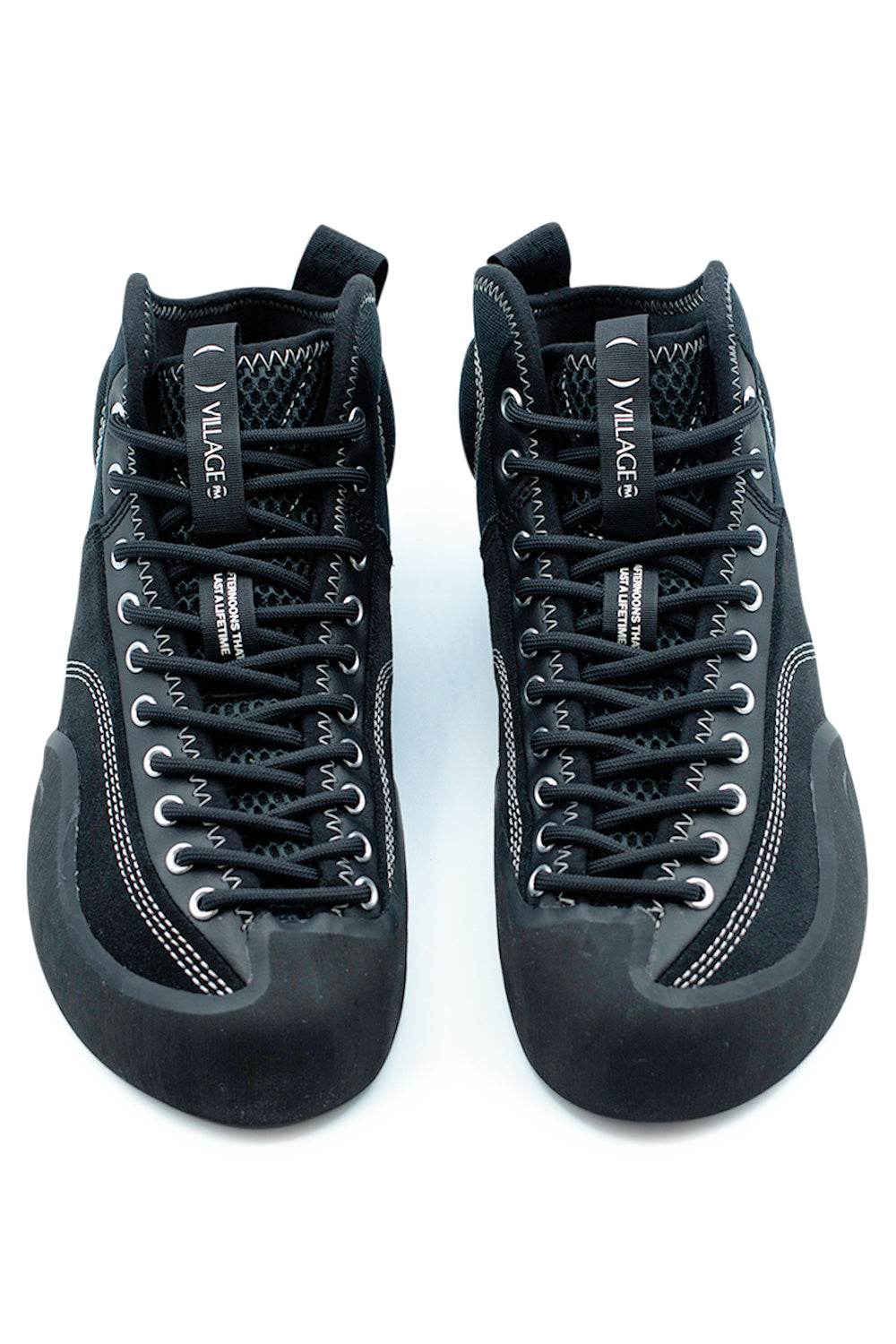 Front view of Village PM 1PM Mid Black Natural Black skate shoes showing full-foot lacing system, breathable mesh tongue and asymmetrical precision fit for advanced skateboard control