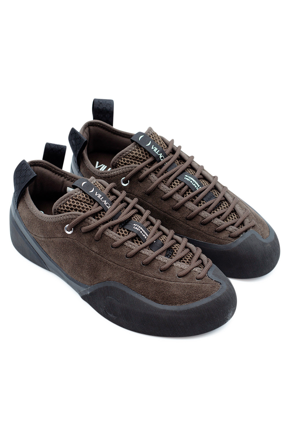 Village PM 1PM Chocolate Natural Black skate shoe pair angled view highlighting premium suede construction, climbing rubber rand wrap and progressive performance skate design