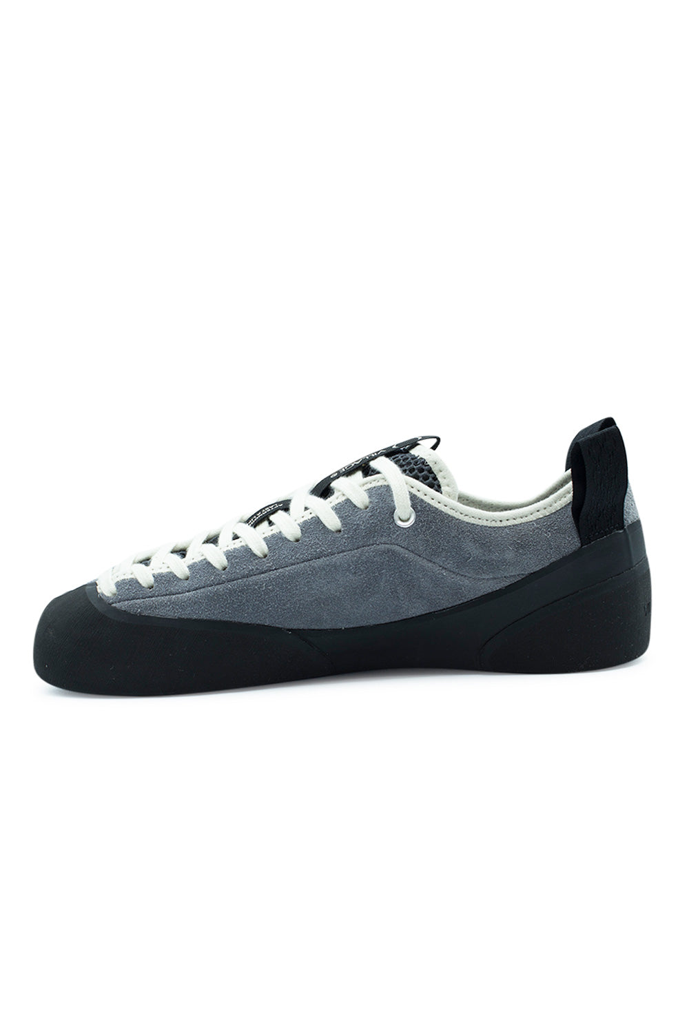 Medial arch profile of the Village PM 1PM shoe, showcasing the seamless inner grey suede quarter panel, reinforced black climbing rubber rand curving under the arch, low-profile collar silhouette, and sturdy rear loop[cite: 93].