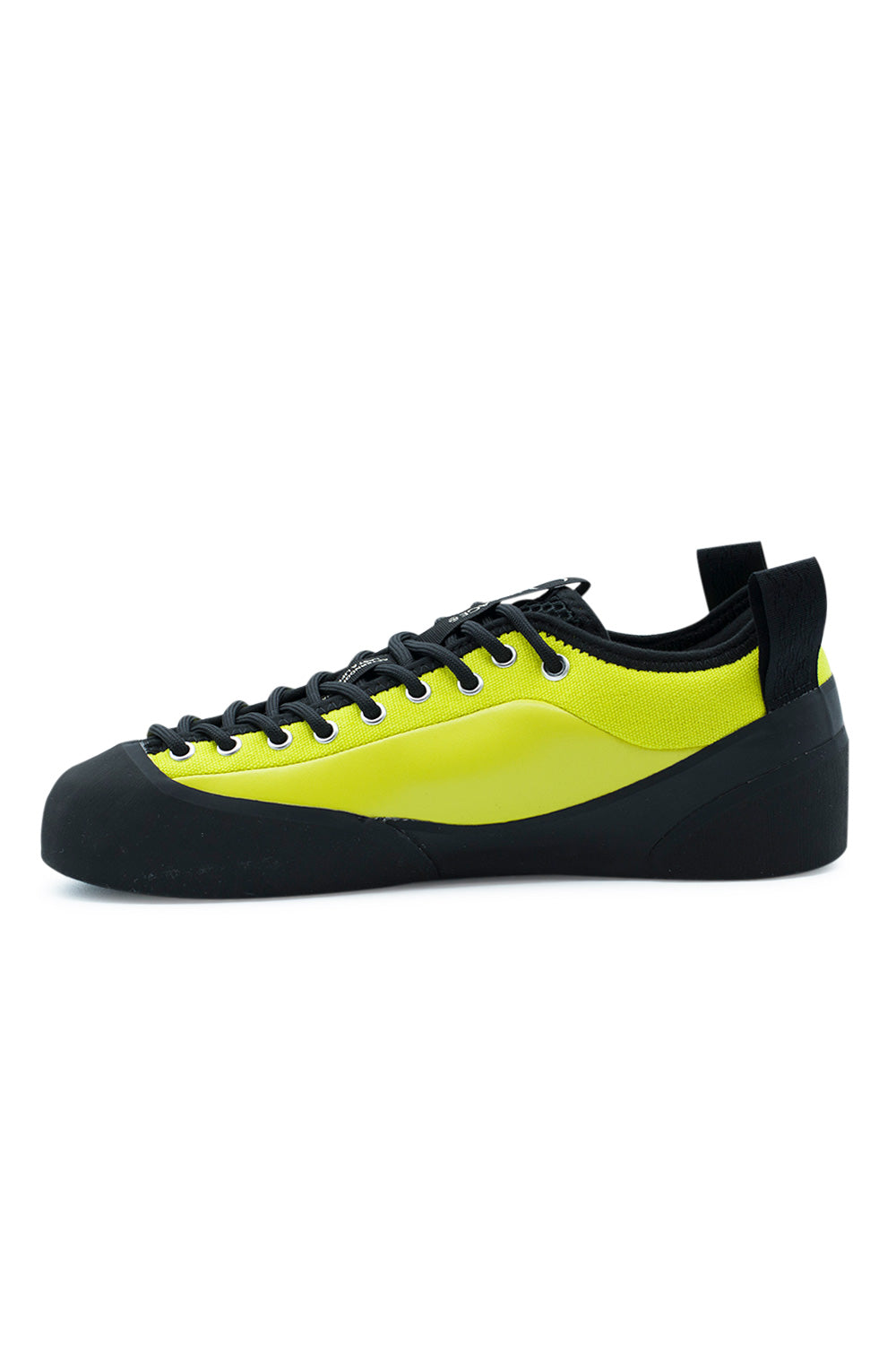 Medial arch profile of the Village PM 1PM sneaker, displaying the clean inner neon lime green leather quarter, black eyelet reinforcement curve, padded collar line, black rear pull tab, and the continuous molded black climbing rubber rand protecting the arch.