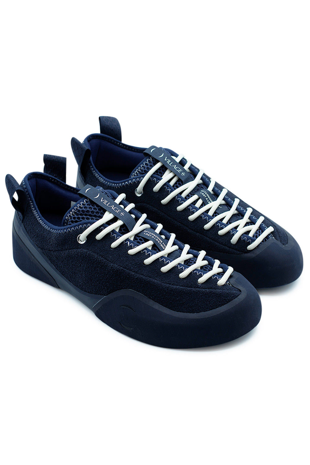 Village PM 1PM Navy Navy skateboarding shoe pair angled view showing climbing rubber rand around the forefoot and flexible Rubber Glove Technology construction